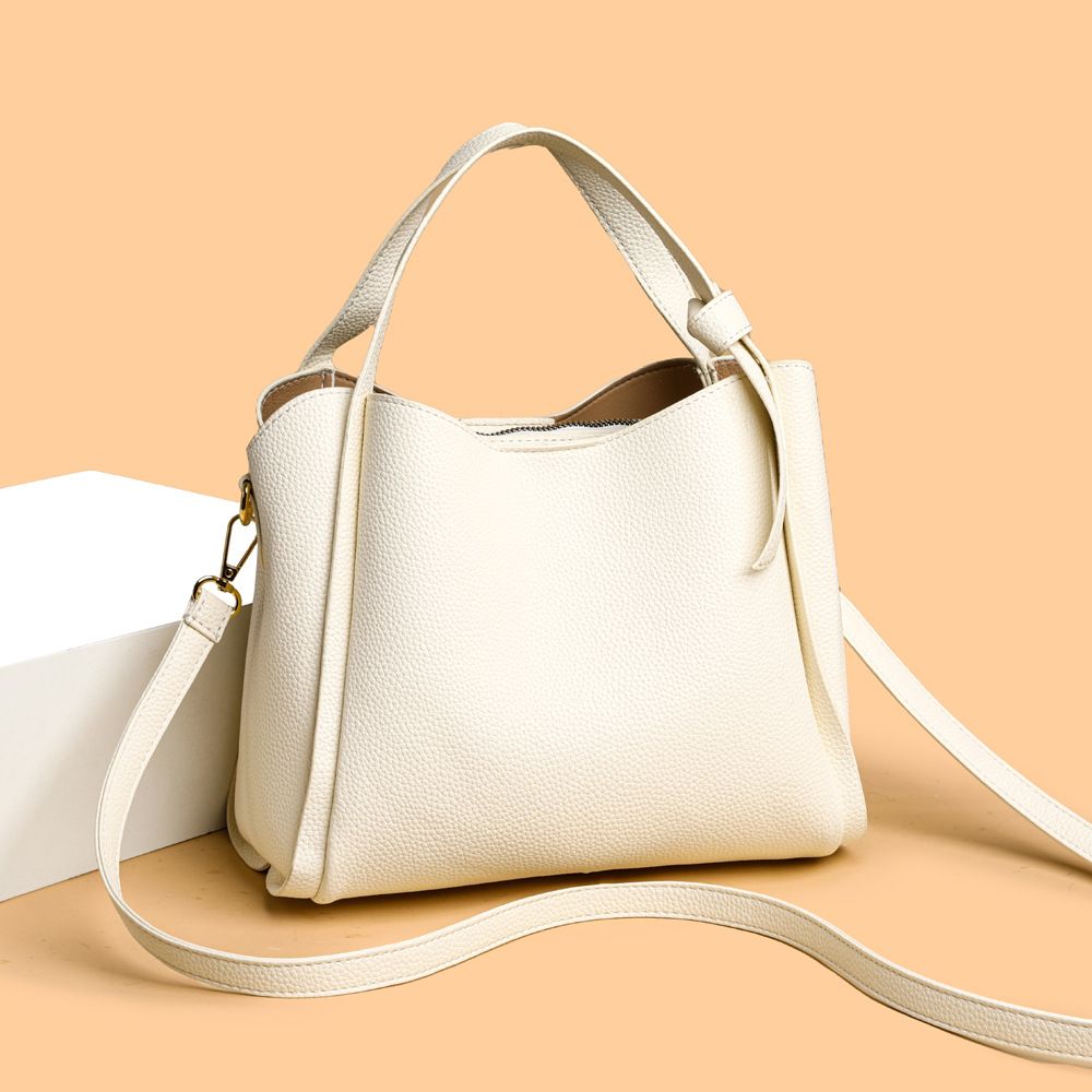 New spring and summer canvas niche design, high-end sense, simple and versatile, bucket chain, hand-held crossbody bag for women