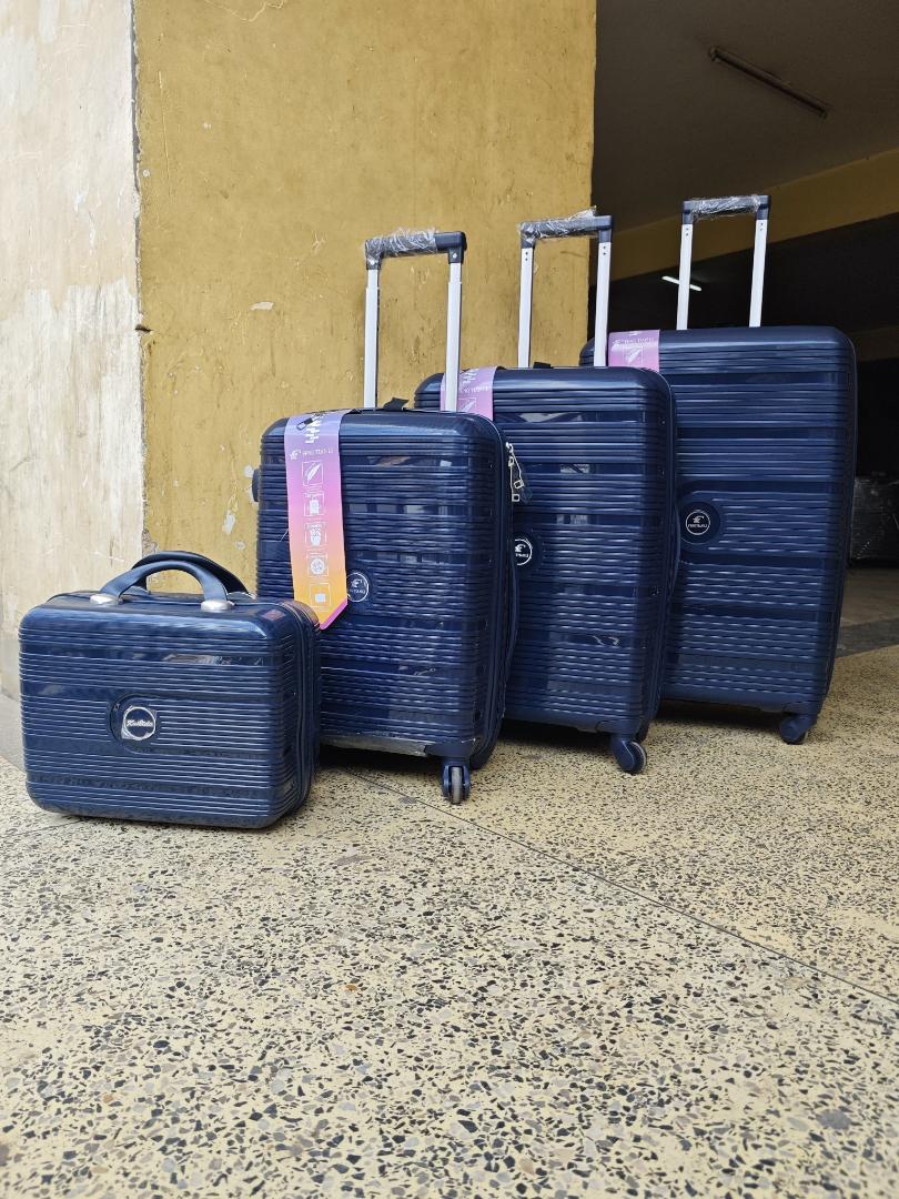4-in-1 unbreakable luggage set -lightweight rubber travel suitcase with cosmetic bag and spinner wheels