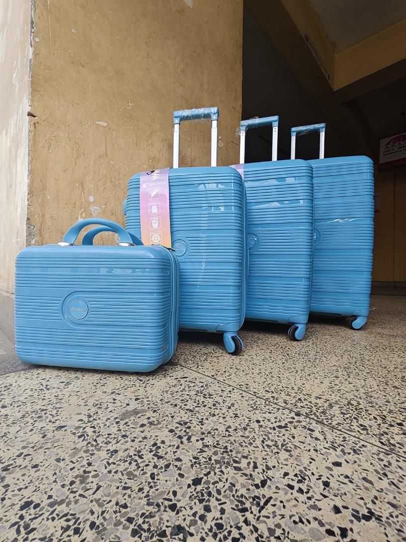 4-in-1 unbreakable luggage set -lightweight rubber travel suitcase with cosmetic bag and spinner wheels