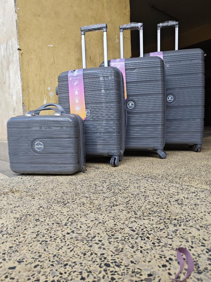 4-in-1 unbreakable luggage set -lightweight rubber travel suitcase with cosmetic bag and spinner wheels
