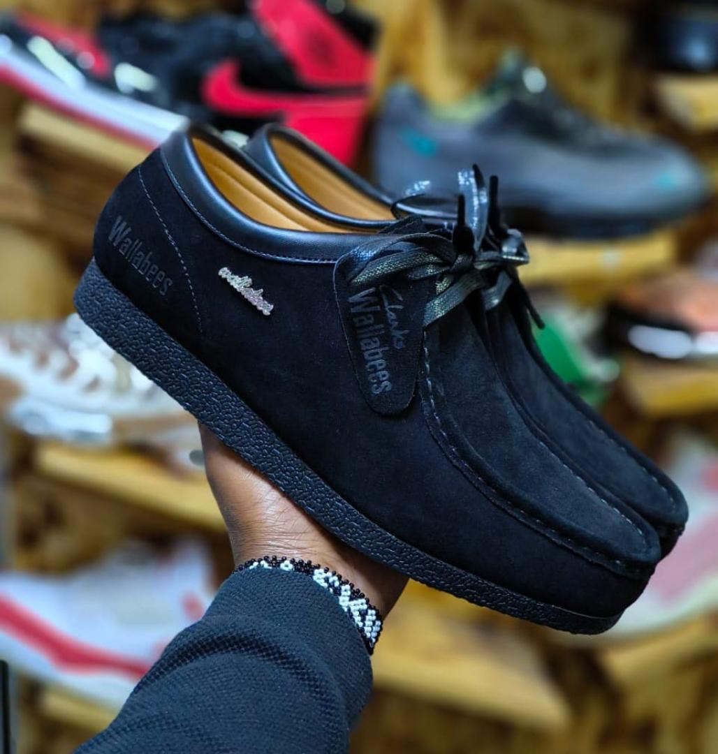 Clarks Wallabee Shoes – Timeless Comfort and Style"Description:Iconic Design: Features a classic moccasin-inspired silhouette for a unique, timeless look.Premium Material: Made from high-quality suede