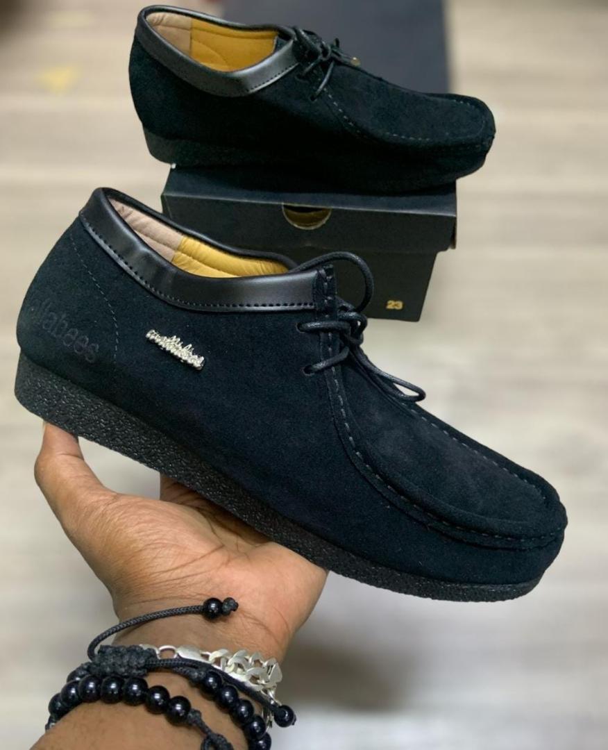 Clarks Wallabee Shoes – Timeless Comfort and Style"Description:Iconic Design: Features a classic moccasin-inspired silhouette for a unique, timeless look.Premium Material: Made from high-quality suede