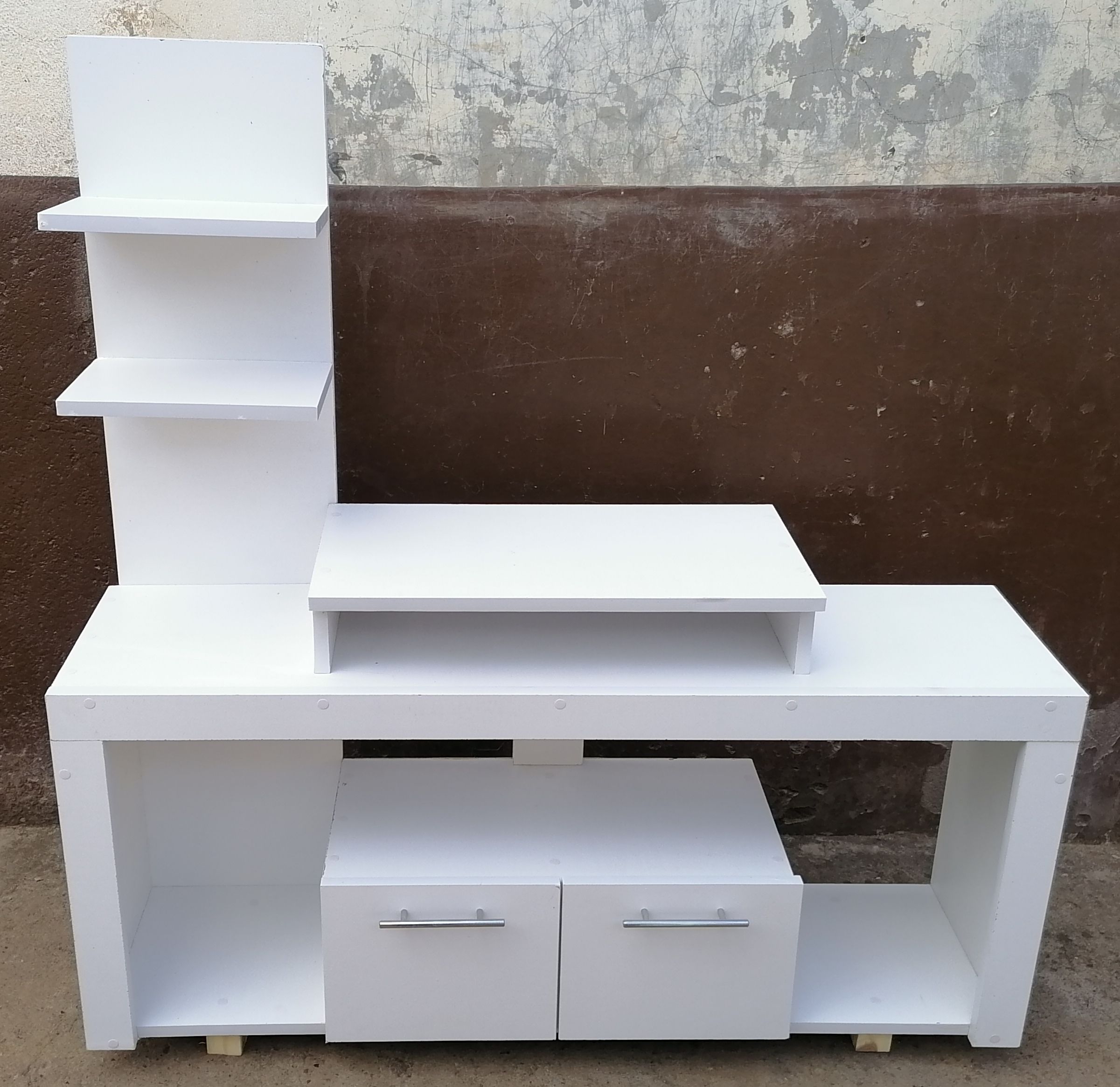 Media Consoles With Integrated Storage Neatly Organized And Display Media Equipment Like TVs, Gaming Consoles, And Sound Systems. They Feature Open Shelves, Closed Cabinets, And Drawers.