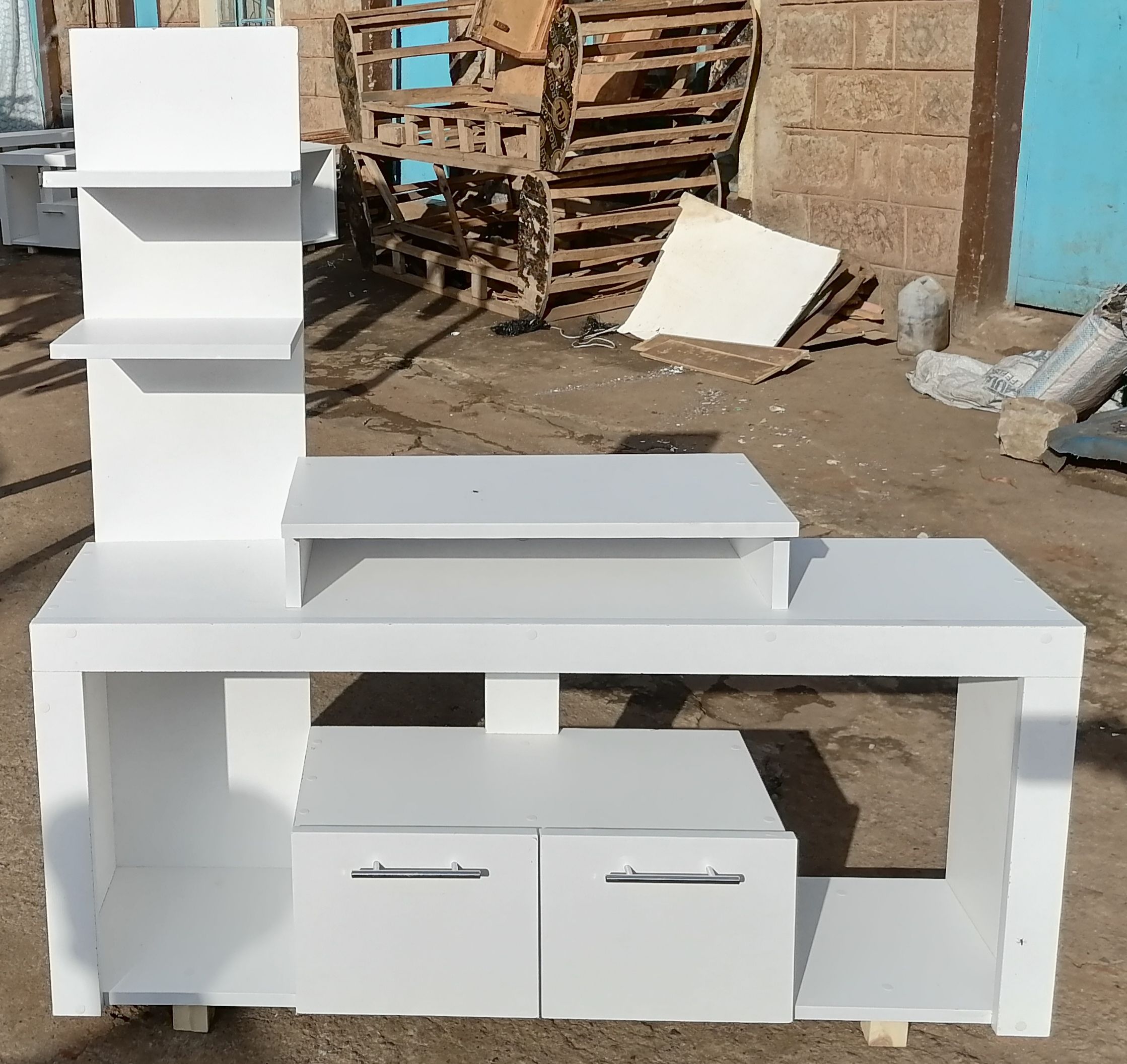 Media Consoles With Integrated Storage Neatly Organized And Display Media Equipment Like TVs, Gaming Consoles, And Sound Systems. They Feature Open Shelves, Closed Cabinets, And Drawers.