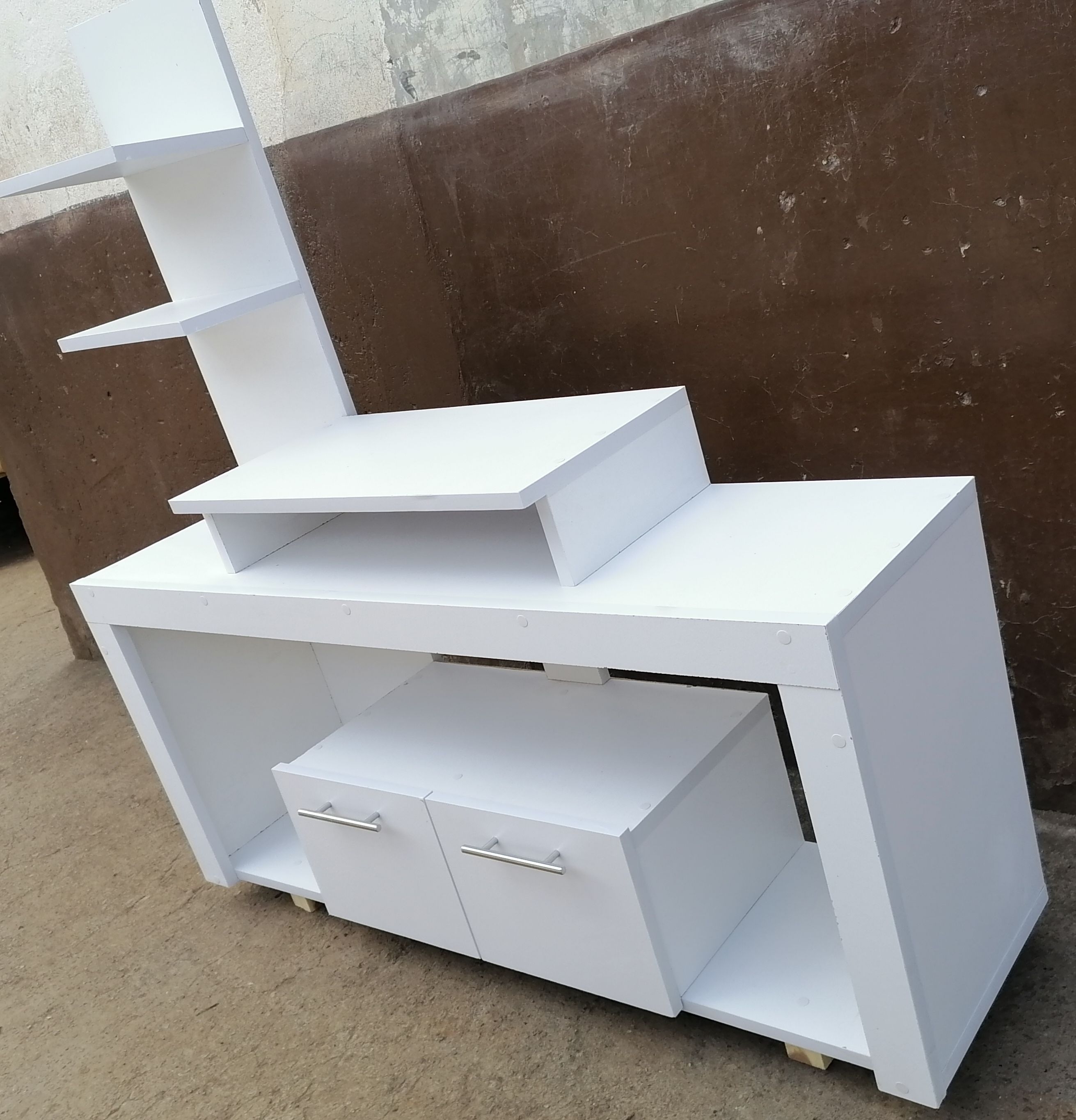 Media Consoles With Integrated Storage Neatly Organized And Display Media Equipment Like TVs, Gaming Consoles, And Sound Systems. They Feature Open Shelves, Closed Cabinets, And Drawers.