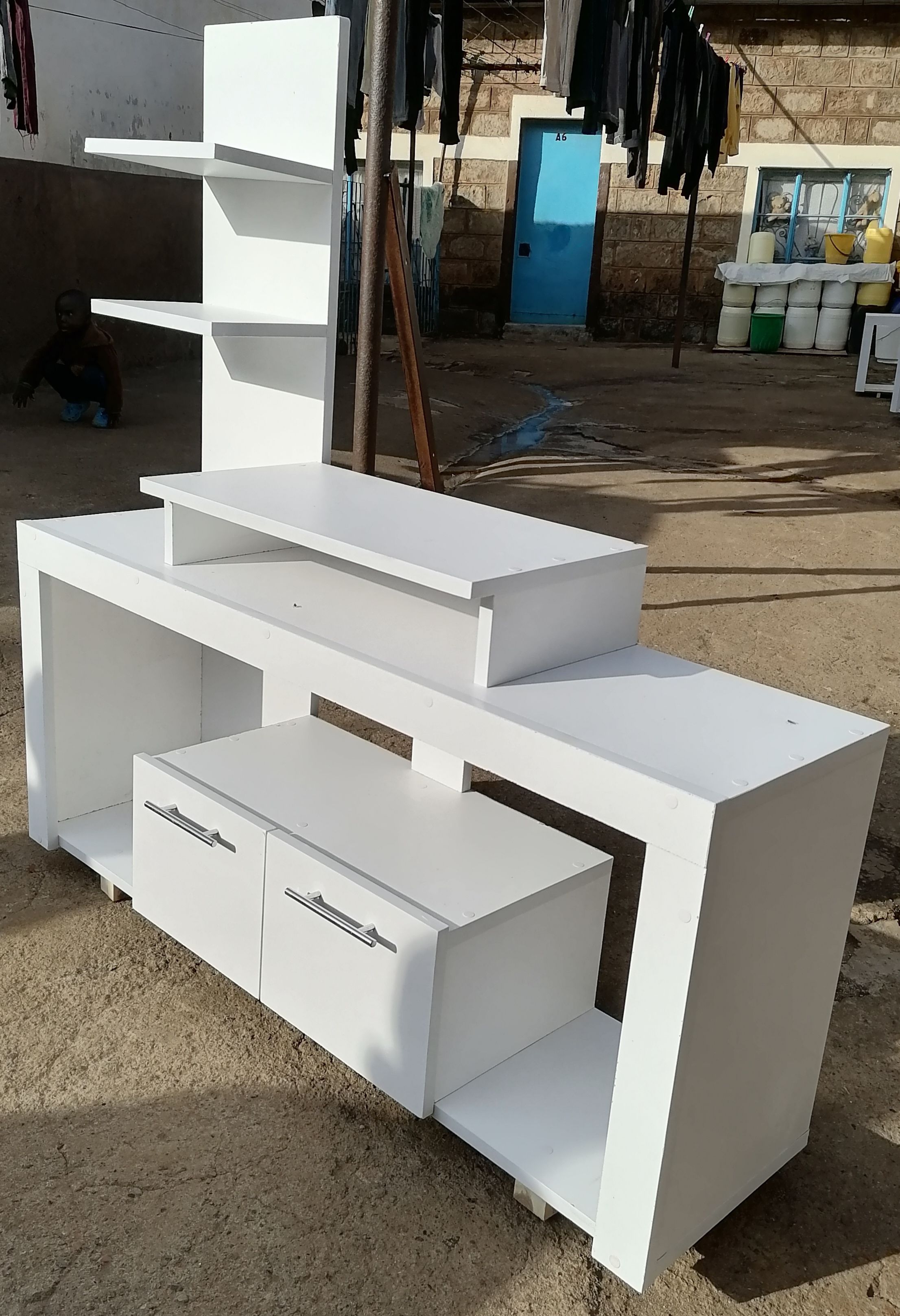Media Consoles With Integrated Storage Neatly Organized And Display Media Equipment Like TVs, Gaming Consoles, And Sound Systems. They Feature Open Shelves, Closed Cabinets, And Drawers.