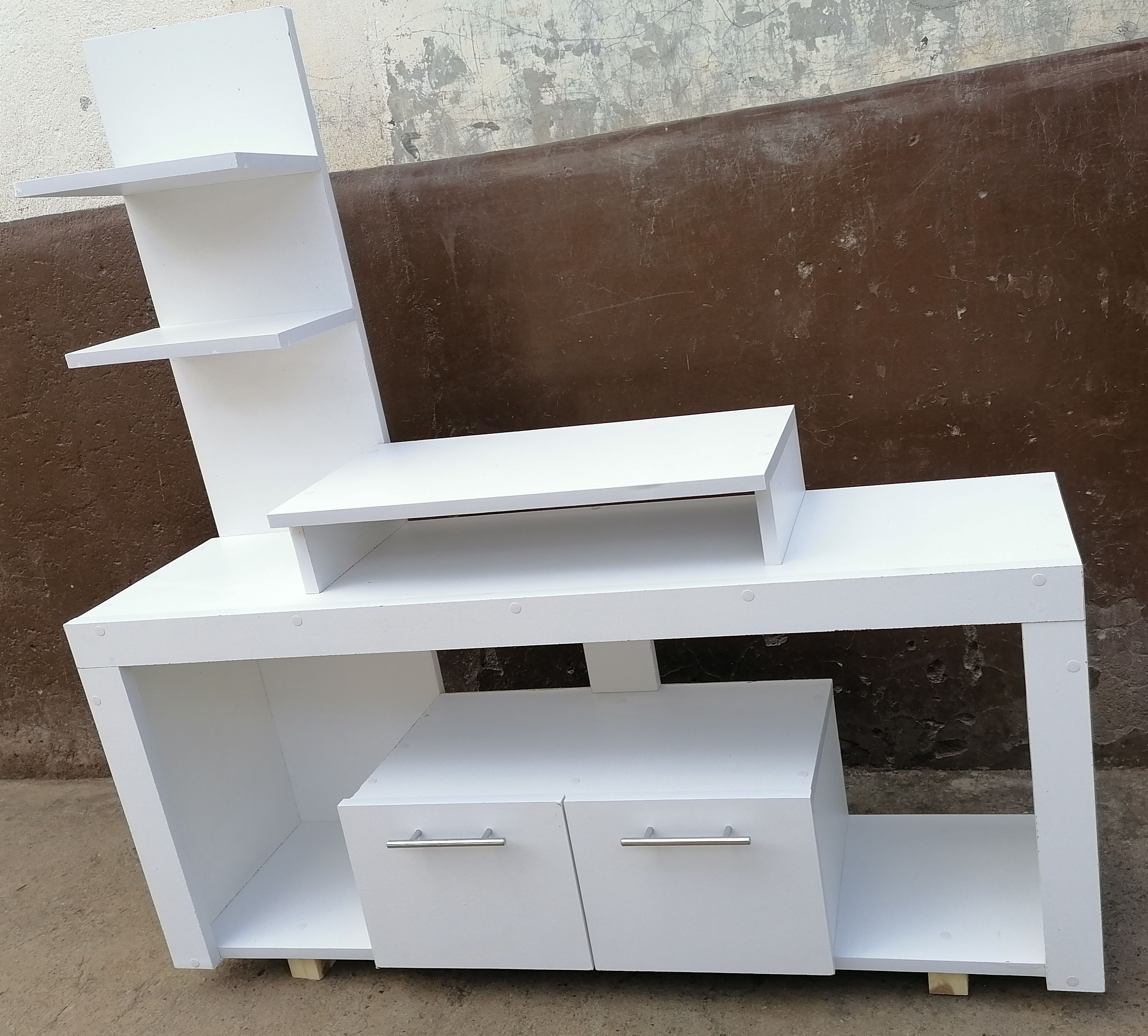 Media Consoles With Integrated Storage Neatly Organized And Display Media Equipment Like TVs, Gaming Consoles, And Sound Systems. They Feature Open Shelves, Closed Cabinets, And Drawers.