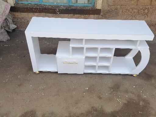 Media Consoles With Integrated Storage Neatly Organized And Display Media Equipment Like TVs Gaming Consoles And Sound Systems They features Open Shelves Closed Cabinets And Drawers
