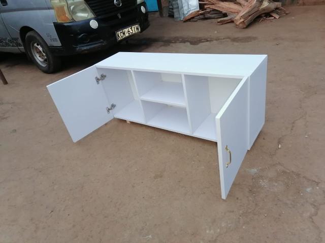 4feet Long Modern TV Stands Enhance Functionality Through Key Features Such As Open Shelving For Easy Access And Ventilation Closed Cabinets  And Drawers For Organized Storage