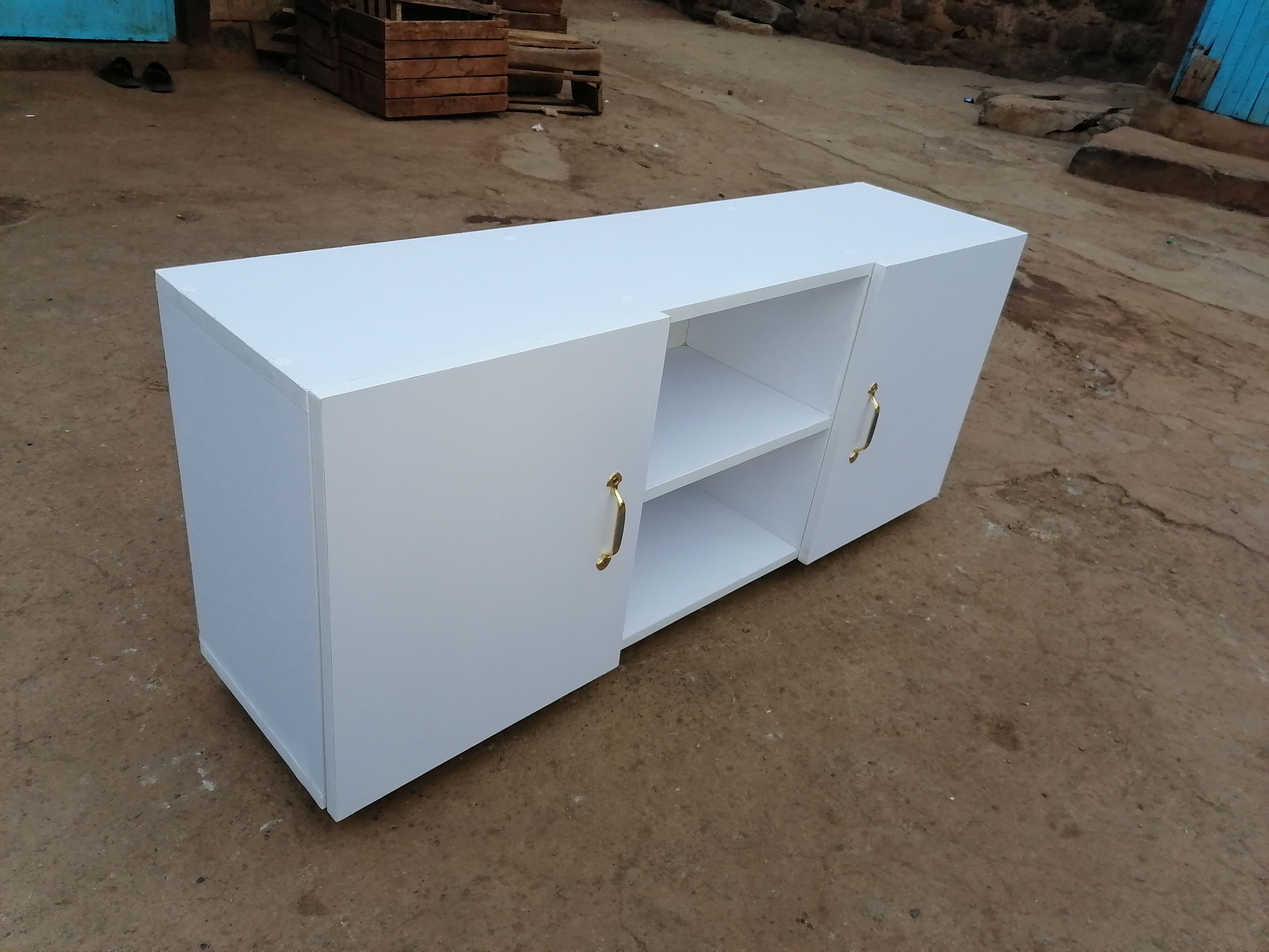 4feet Long Modern TV Stands Enhance Functionality Through Key Features Such As Open Shelving For Easy Access And Ventilation Closed Cabinets  And Drawers For Organized Storage