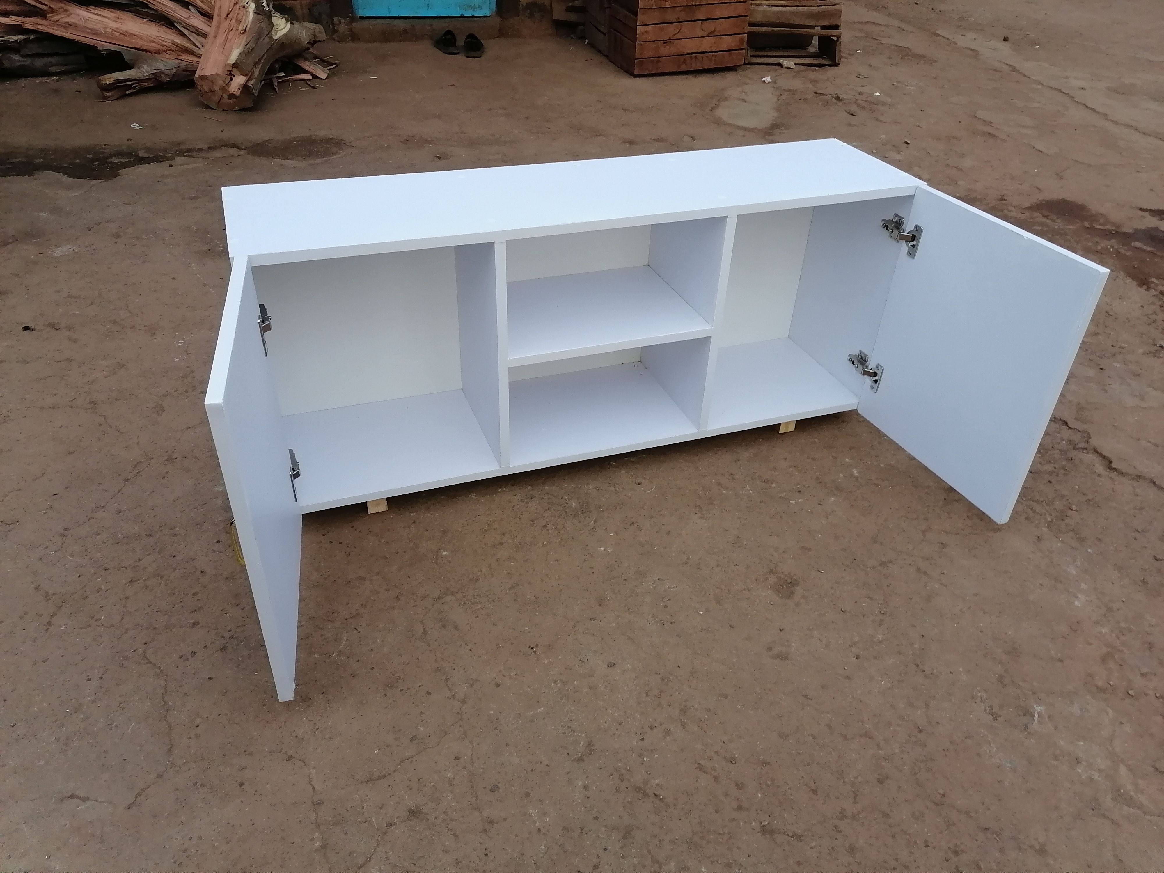 4feet Long Modern TV Stands Enhance Functionality Through Key Features Such As Open Shelving For Easy Access And Ventilation Closed Cabinets  And Drawers For Organized Storage