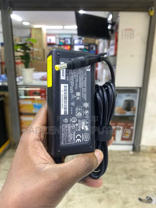 HP LAPTOP CHARGER/ADAPTER 18.5V,3.5A Yellow Pin - Black. With Free Power Cable For Hp laptops. HP Elitebook 810 820 840 850 e.t.c. Laptops.