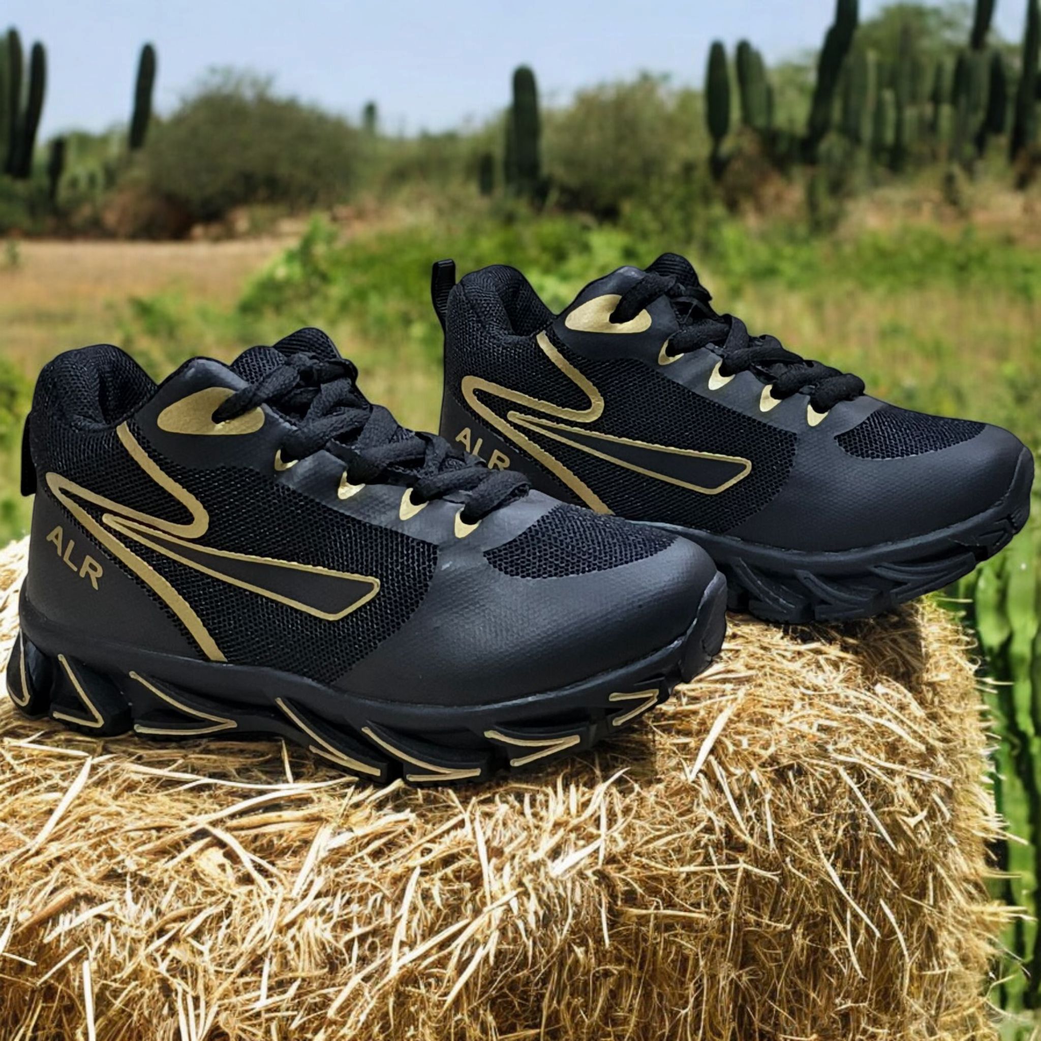 ALR V-Design Athletic kids Shoes. The shoes feature a black color scheme with white, gold,red and orange accents. Suitable for sports and averyday wear.