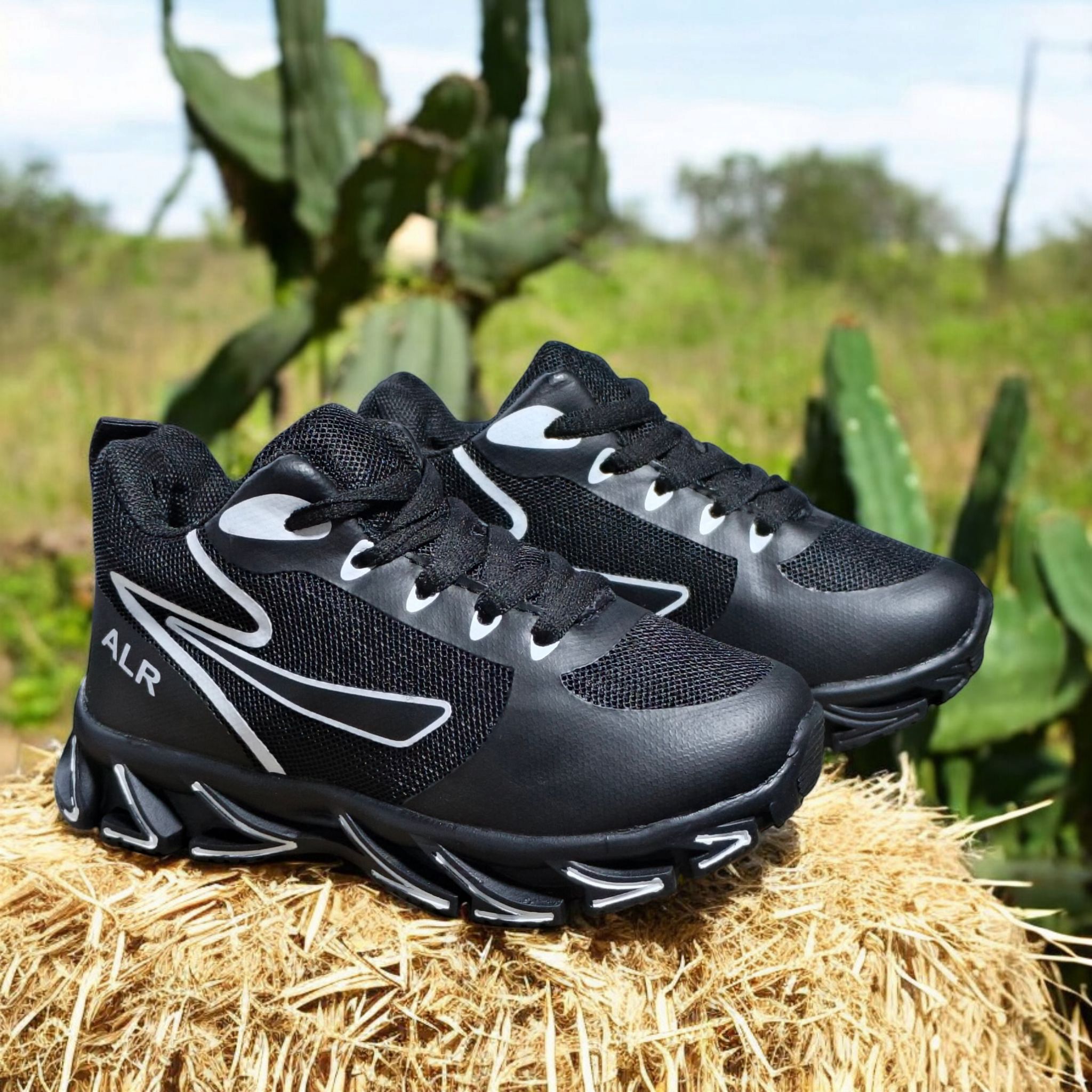 ALR V-Design Athletic kids Shoes. The shoes feature a black color scheme with white, gold,red and orange accents. Suitable for sports and averyday wear.