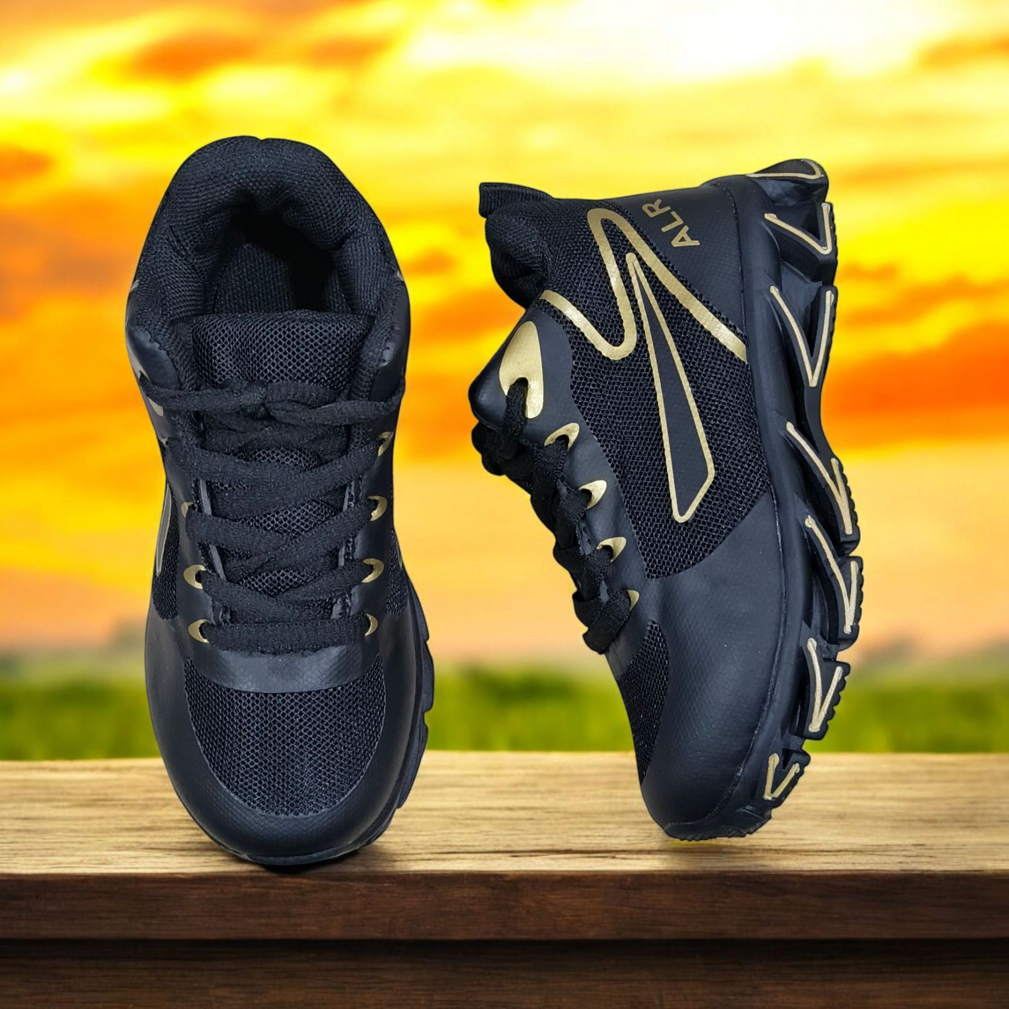 ALR V-Design Athletic kids Shoes. The shoes feature a black color scheme with white, gold,red and orange accents. Suitable for sports and averyday wear.