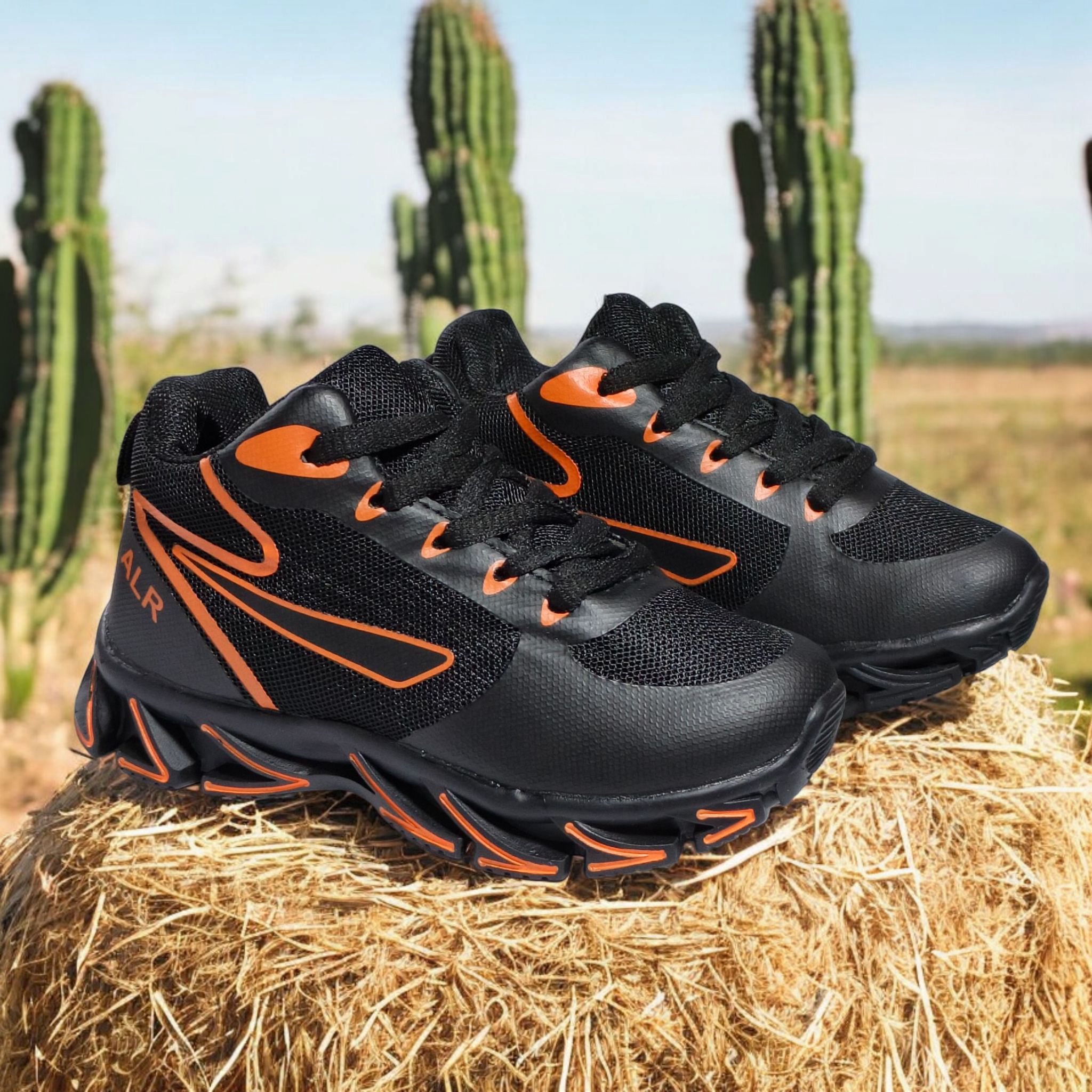 ALR V-Design Athletic kids Shoes. The shoes feature a black color scheme with white, gold,red and orange accents. Suitable for sports and averyday wear.