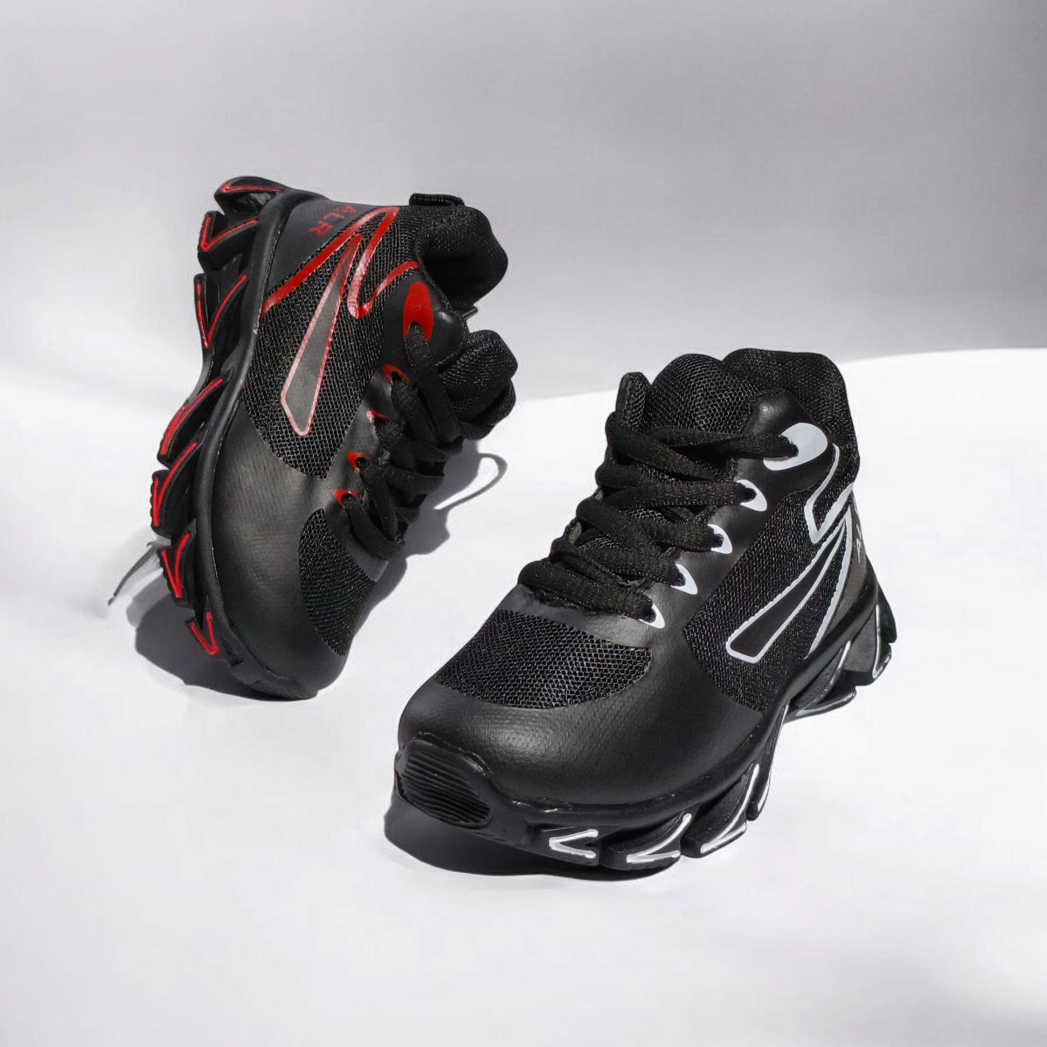 ALR V-Design Athletic kids Shoes. The shoes feature a black color scheme with white, gold,red and orange accents. Suitable for sports and averyday wear.