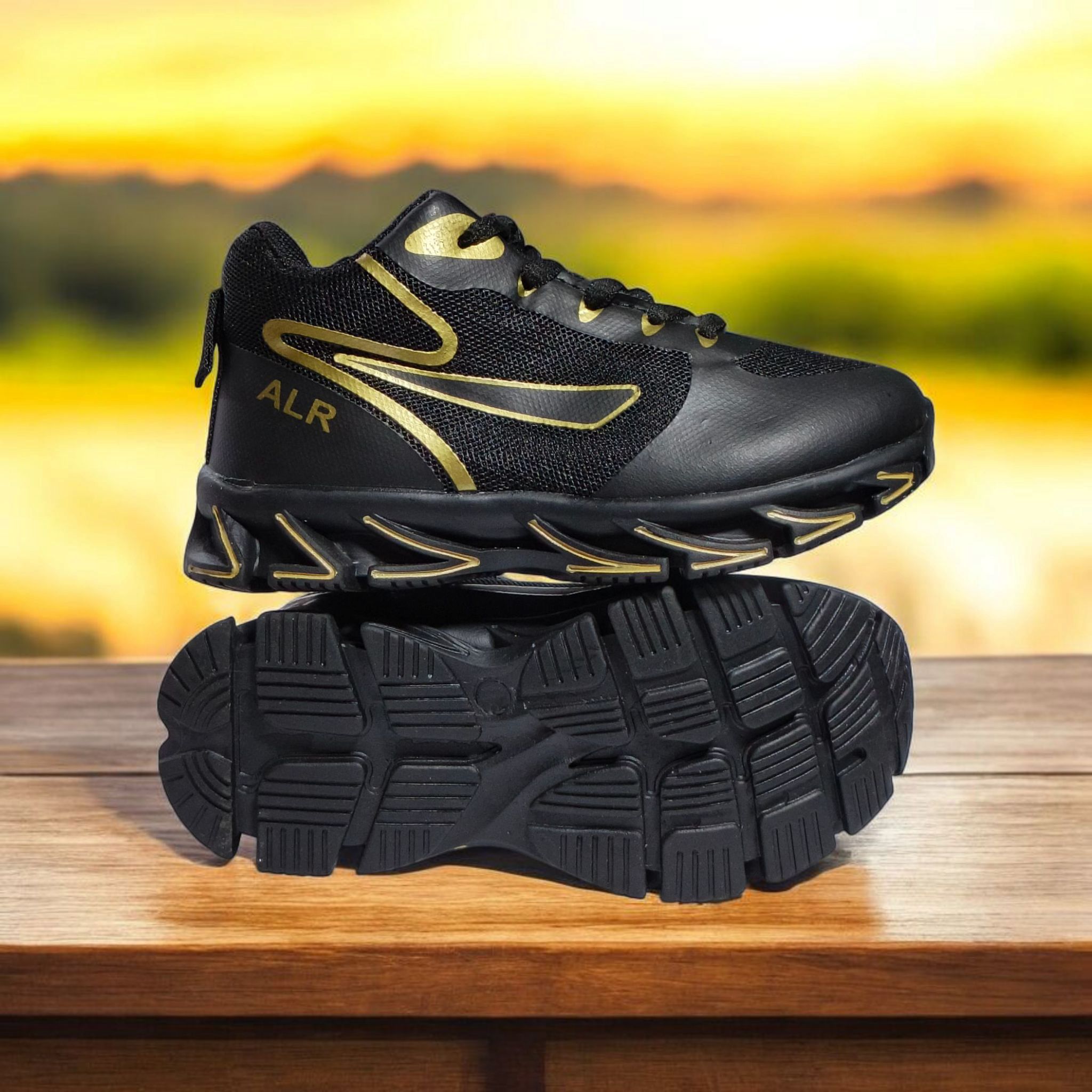 ALR V-Design Athletic kids Shoes. The shoes feature a black color scheme with white, gold,red and orange accents. Suitable for sports and averyday wear.