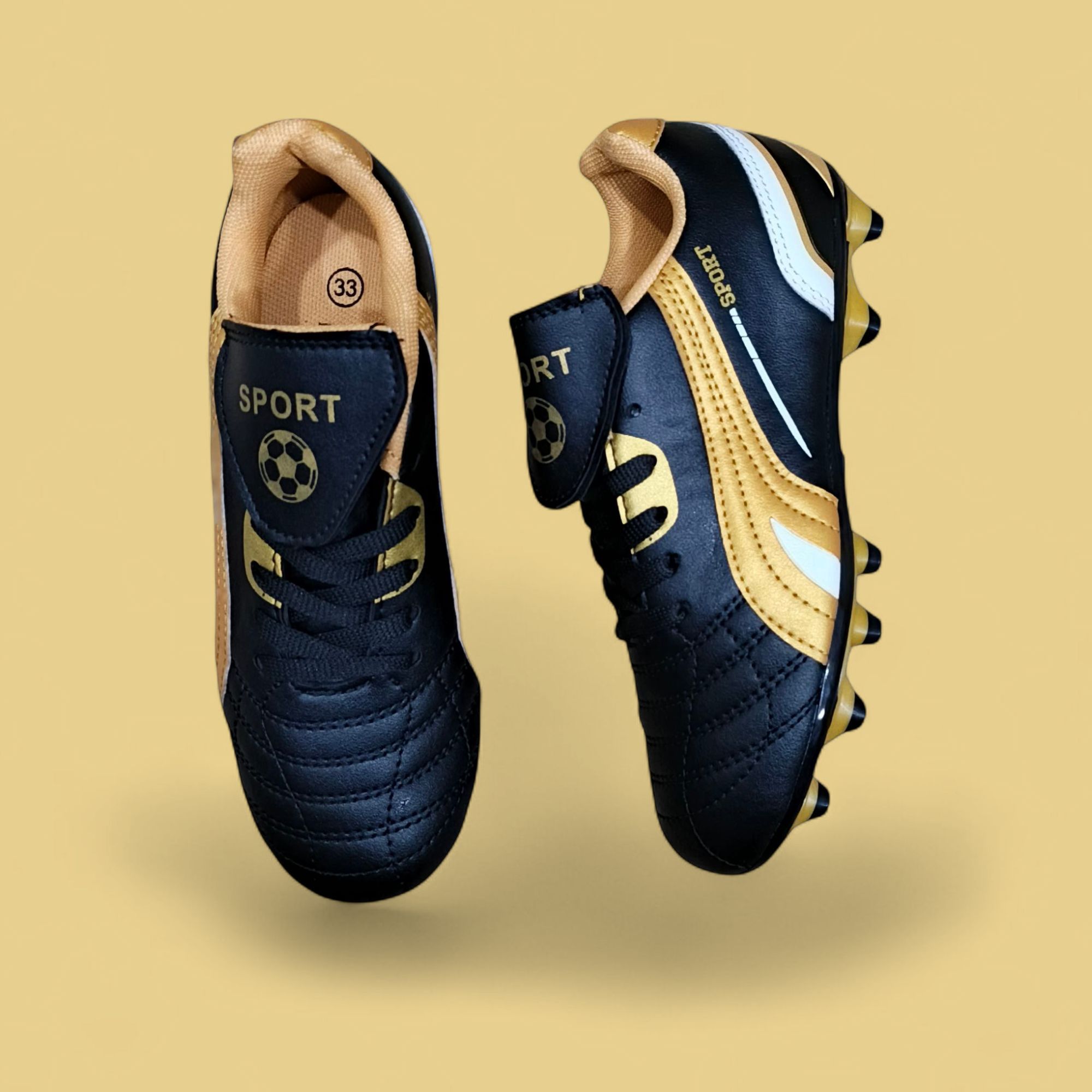 KIDS SOCCER BOOTS. A PAIR OF SOCCER CLEATS; FOOTBALL BOOTS.