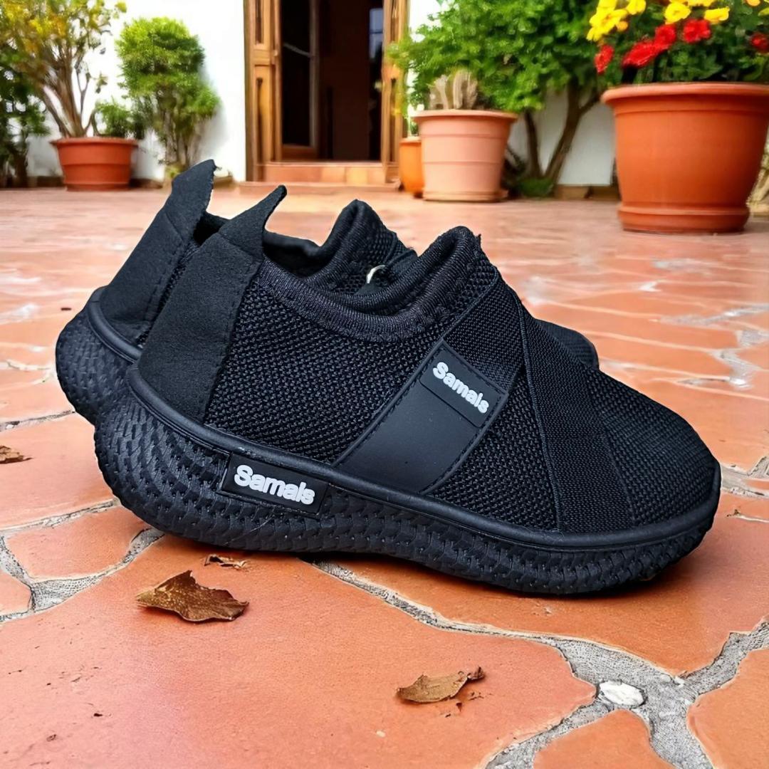 Step into Sleek, All-Black Slip-Ons for kids and adults sneakers. Black never looked this bold, slip-on mesh sneakers. Effortless style in every step, build for the street. School sport shoes.