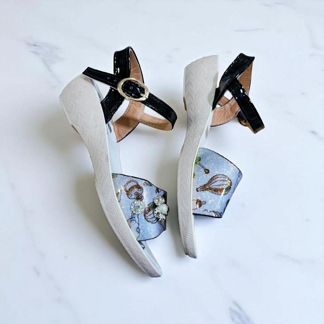 Girls summer sandals with straps and flower charm. Cute shimmering Colors and black ankle straps.