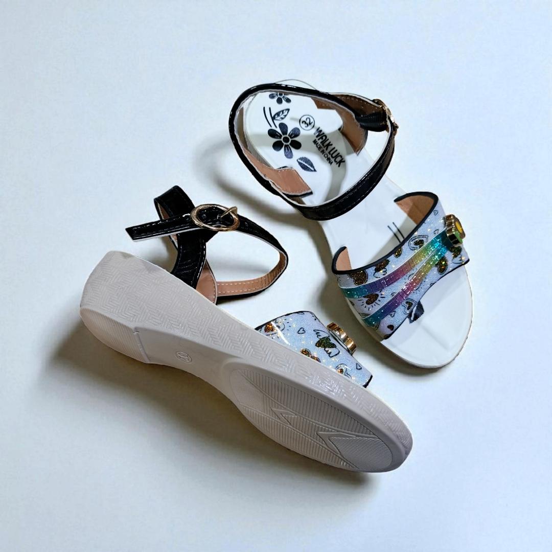 Girls summer sandals with straps and flower charm. Cute shimmering Colors and black ankle straps.