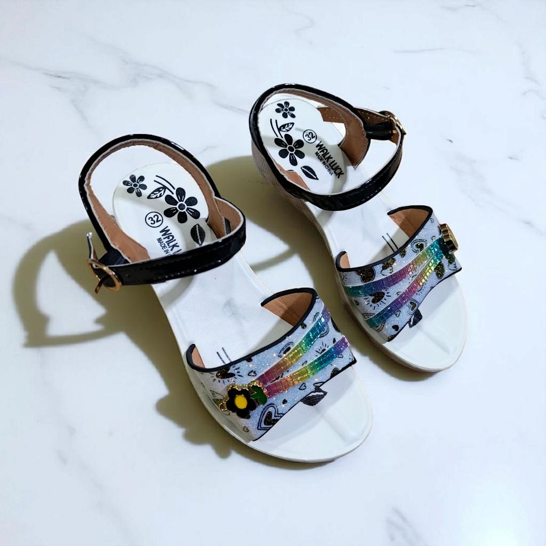 Girls summer sandals with straps and flower charm. Cute shimmering Colors and black ankle straps.