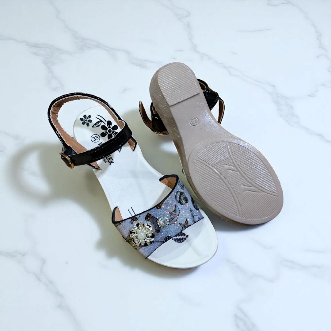 Girls summer sandals with straps and flower charm. Cute shimmering Colors and black ankle straps.