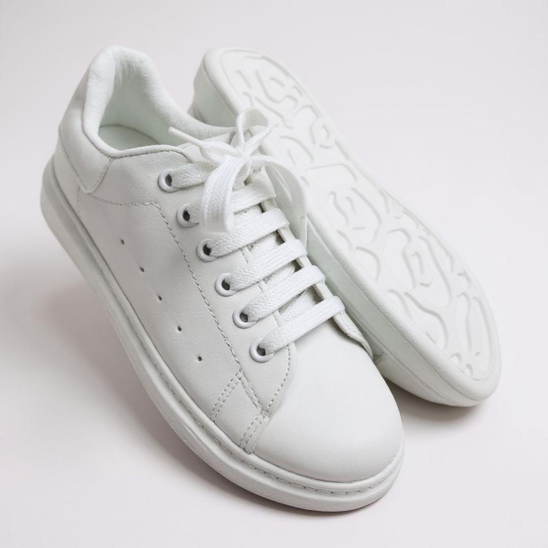 Classic white sneakers. Comfortable , versatile kids white sport shoes. School casual, minimalist, sporty white sport shoes. Clean and fresh look of a white sneaker.