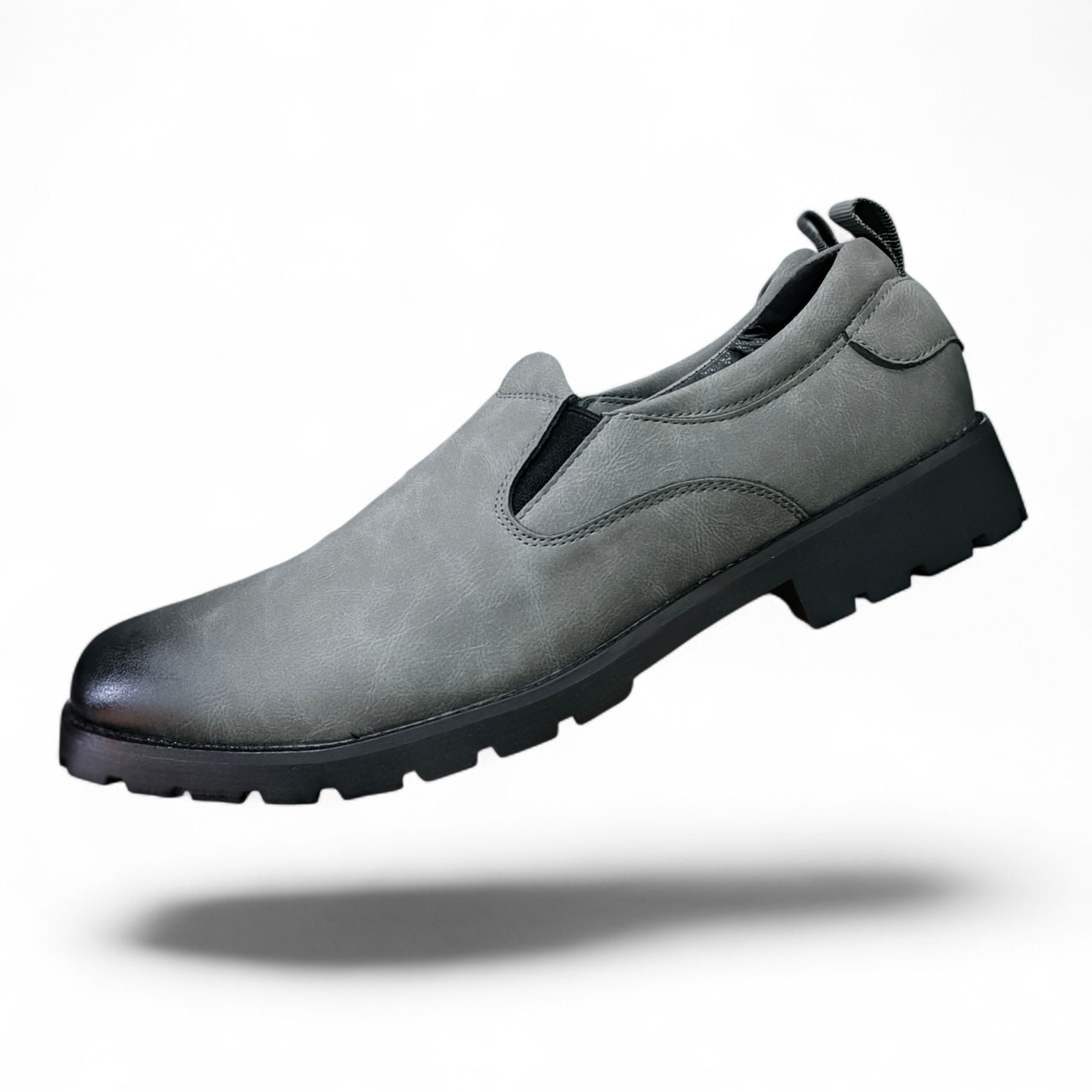 The Executive Glide Slip-On Leather Loafers for the Modern Man. Grey Leather Slip-Ons With Durable Tread. Instant Upgrade, Premium Grey Faux Leather comfort slip-ons. The essential comfort loafers. Wa