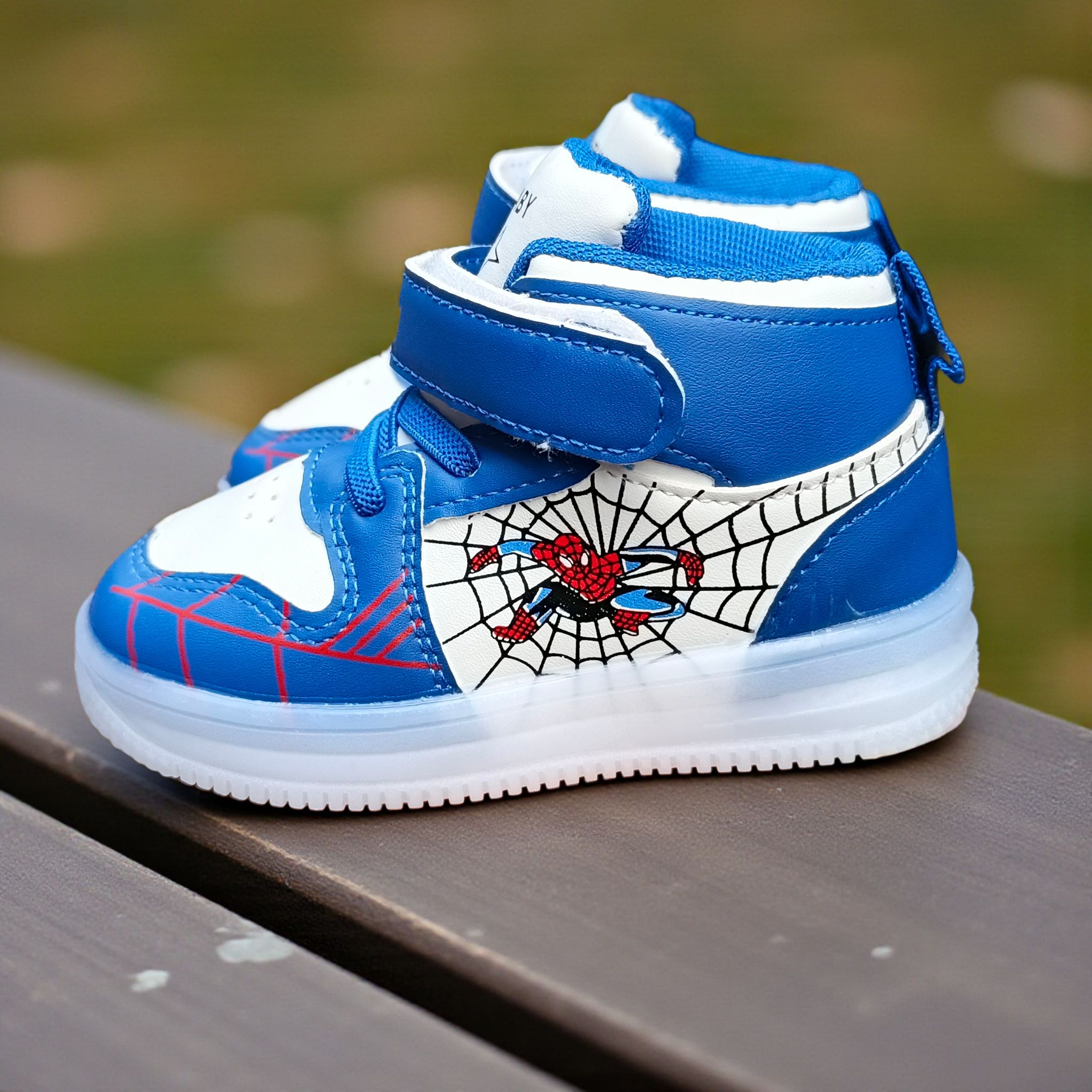 Marvel Spider Man Light-up High-top Sneakers for Boys. Blue , black & white web design. Spiderman Flashing high-top shoes for toddler or little boys. Durable Hight-top Sneakers with Iconic Webbing.