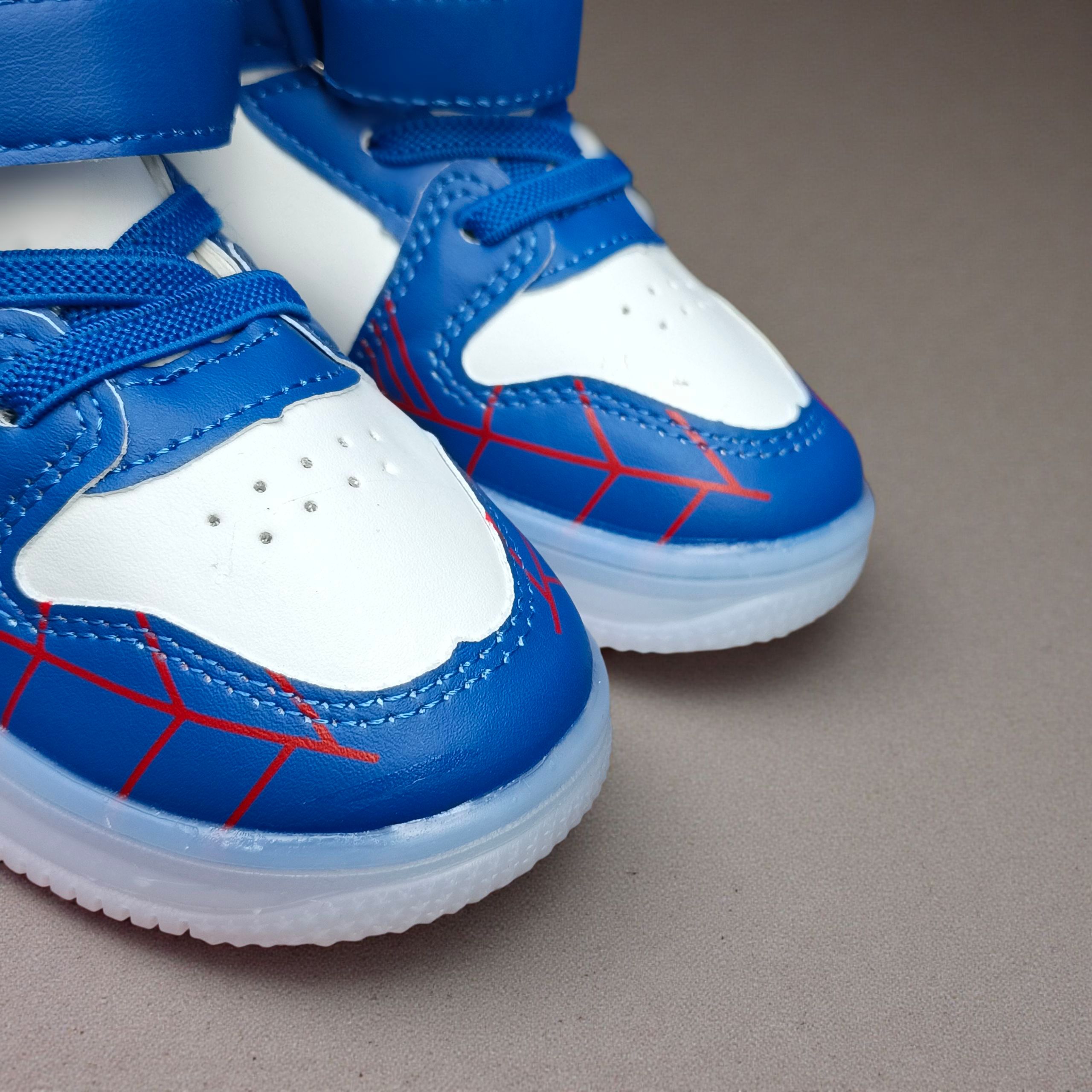 Marvel Spider Man Light-up High-top Sneakers for Boys. Blue , black & white web design. Spiderman Flashing high-top shoes for toddler or little boys. Durable Hight-top Sneakers with Iconic Webbing.