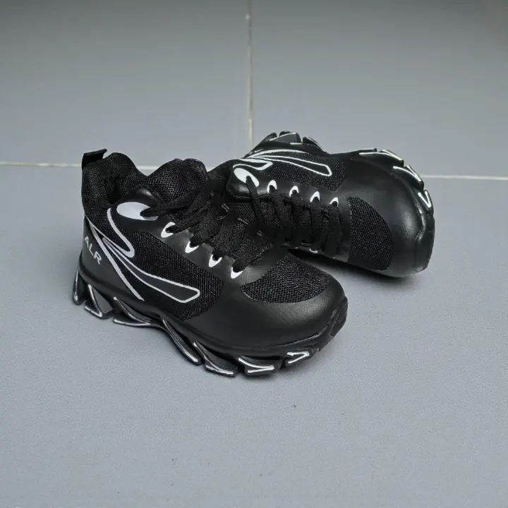 ALR V-Design Athletic kids Shoes. The shoes feature a black color scheme with white, gold,red and orange accents. Suitable for sports and averyday wear.