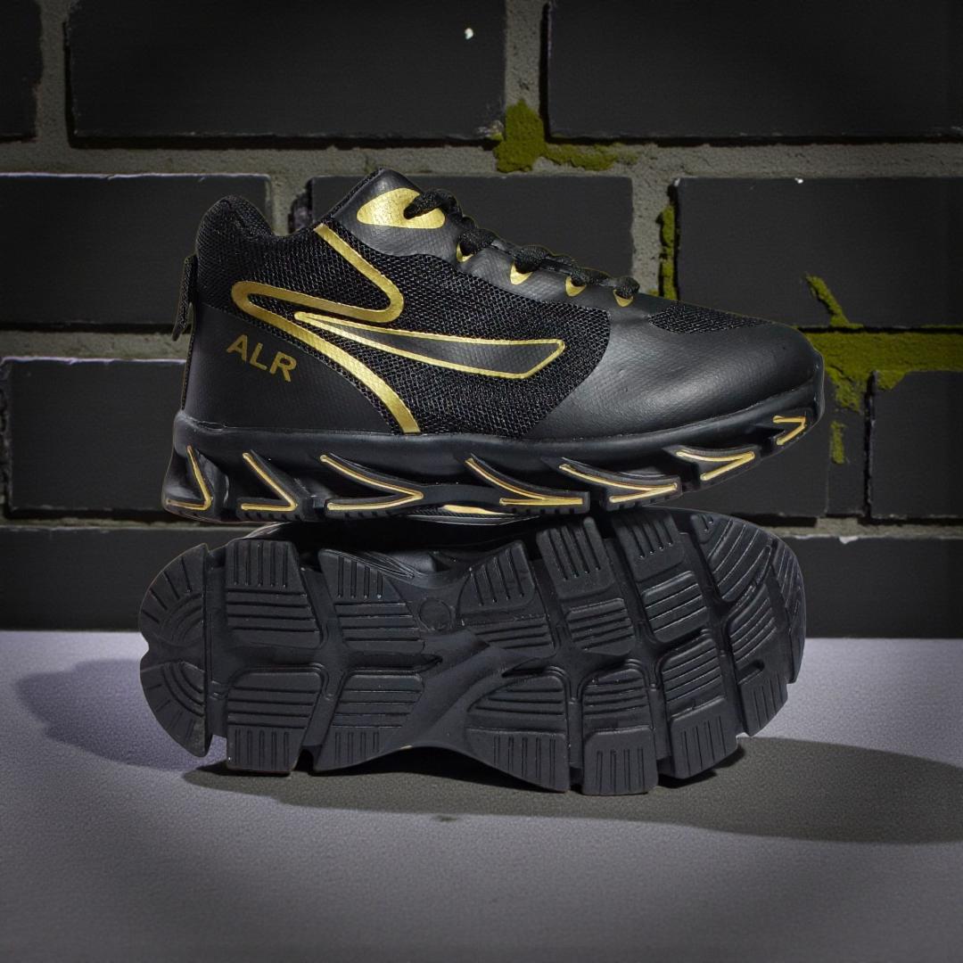 ALR V-Design Athletic kids Shoes. The shoes feature a black color scheme with white, gold,red and orange accents. Suitable for sports and averyday wear.