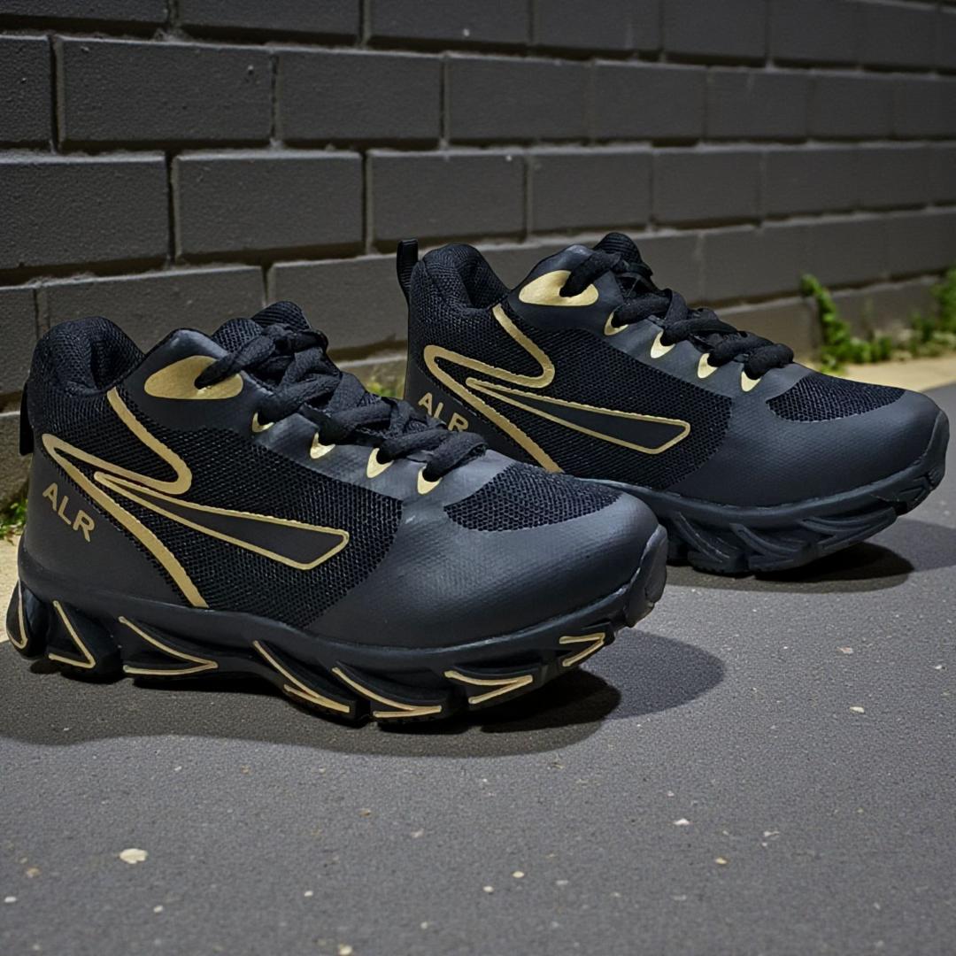 ALR V-Design Athletic kids Shoes. The shoes feature a black color scheme with white, gold,red and orange accents. Suitable for sports and averyday wear.