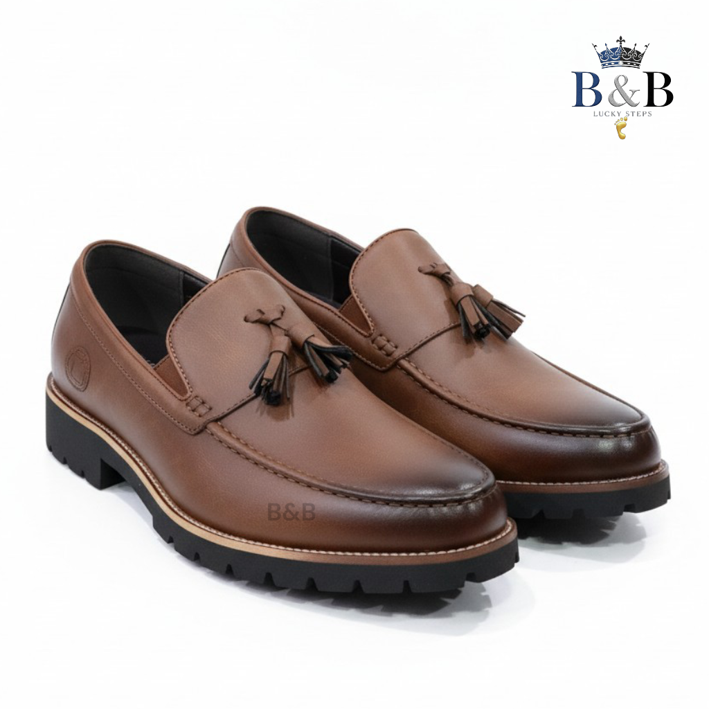 The Hybrid Loafer. Men's Rugged Tassel Loafers in Burnished Walnut,  Heritage Leather Slip-Ons with Commando Lug Soles. Men’s Toffee Brown Faux-Leather Loafers with Cleated Treads.