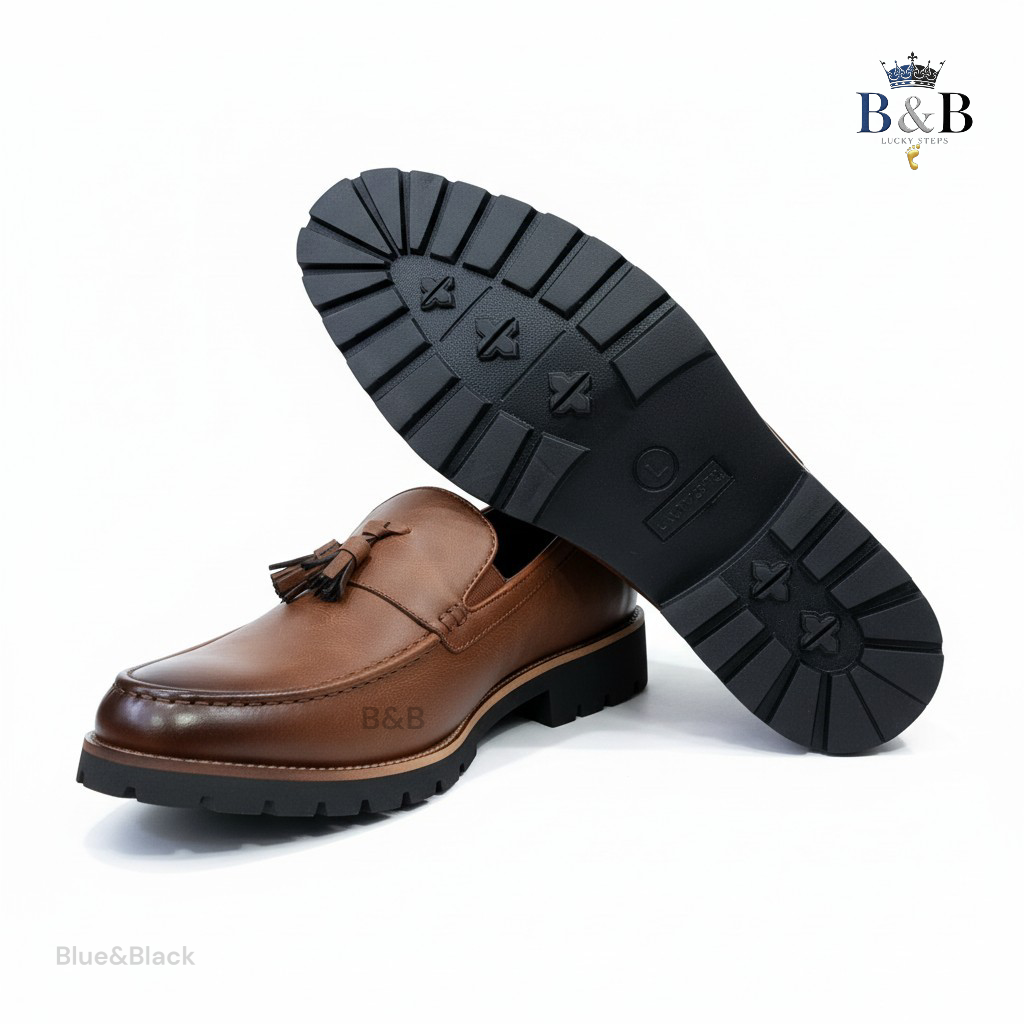 The Hybrid Loafer. Men's Rugged Tassel Loafers in Burnished Walnut,  Heritage Leather Slip-Ons with Commando Lug Soles. Men’s Toffee Brown Faux-Leather Loafers with Cleated Treads.