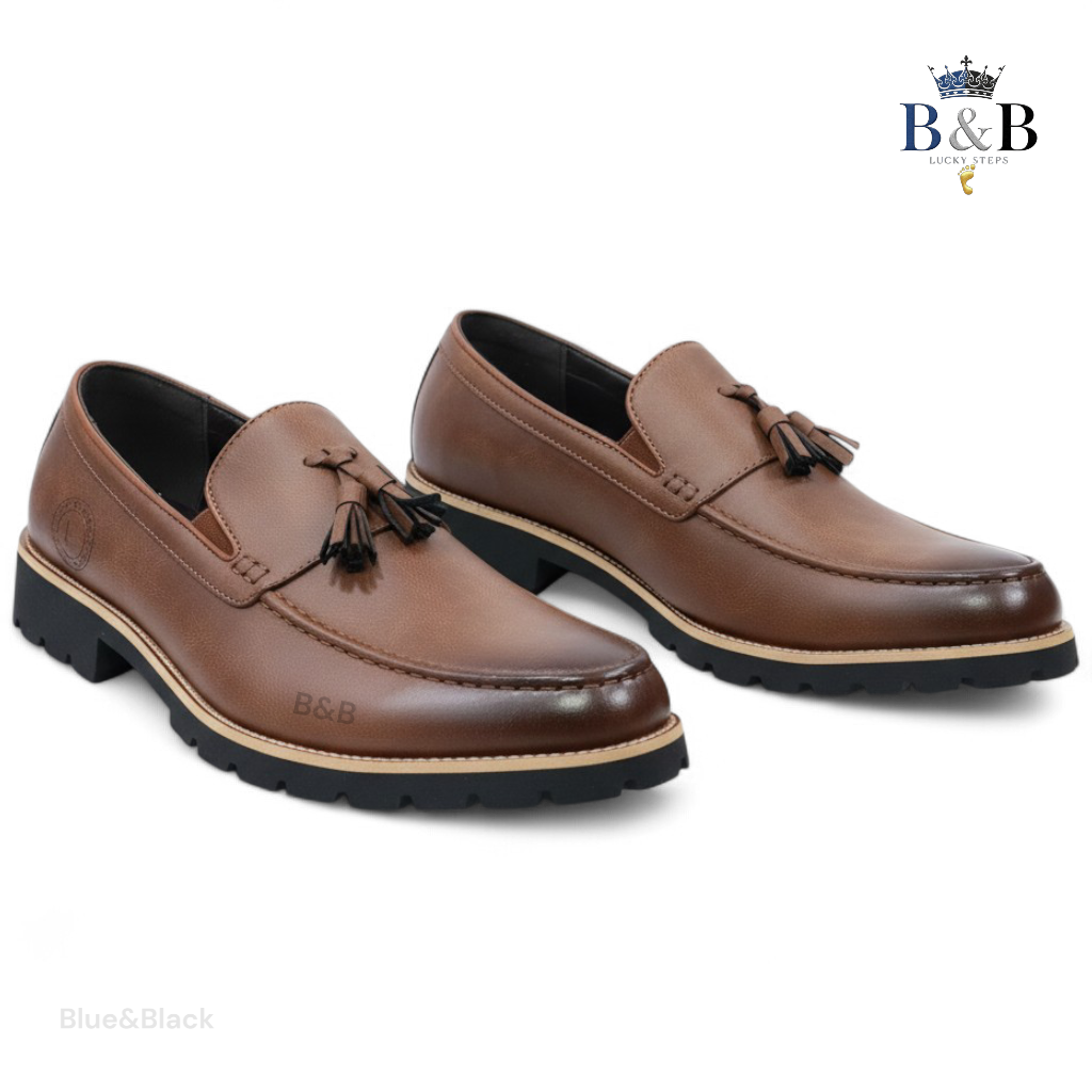 The Hybrid Loafer. Men's Rugged Tassel Loafers in Burnished Walnut,  Heritage Leather Slip-Ons with Commando Lug Soles. Men’s Toffee Brown Faux-Leather Loafers with Cleated Treads.