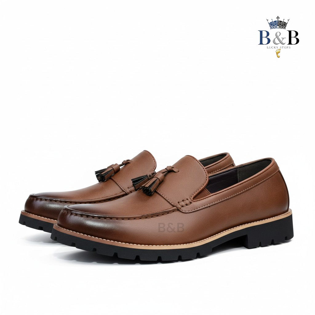 The Hybrid Loafer. Men's Rugged Tassel Loafers in Burnished Walnut,  Heritage Leather Slip-Ons with Commando Lug Soles. Men’s Toffee Brown Faux-Leather Loafers with Cleated Treads.