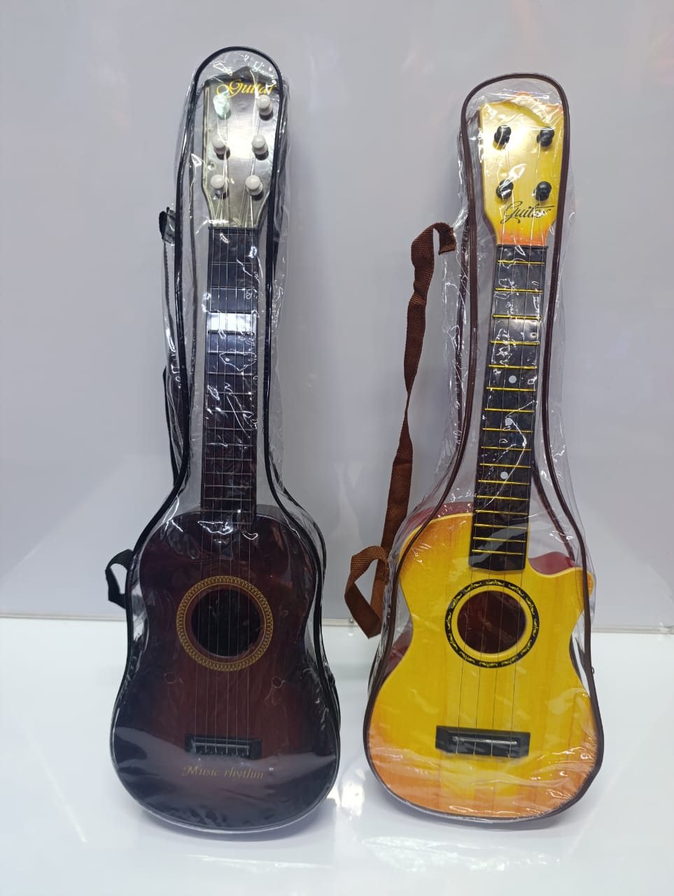 Acoustic Kids Guitar. This is just a guitar itself and is for children to pretend to play the guitar Minimum Recommended Age 3 Years+ It is a cute instrument which sounds pleasant and is easy to learn