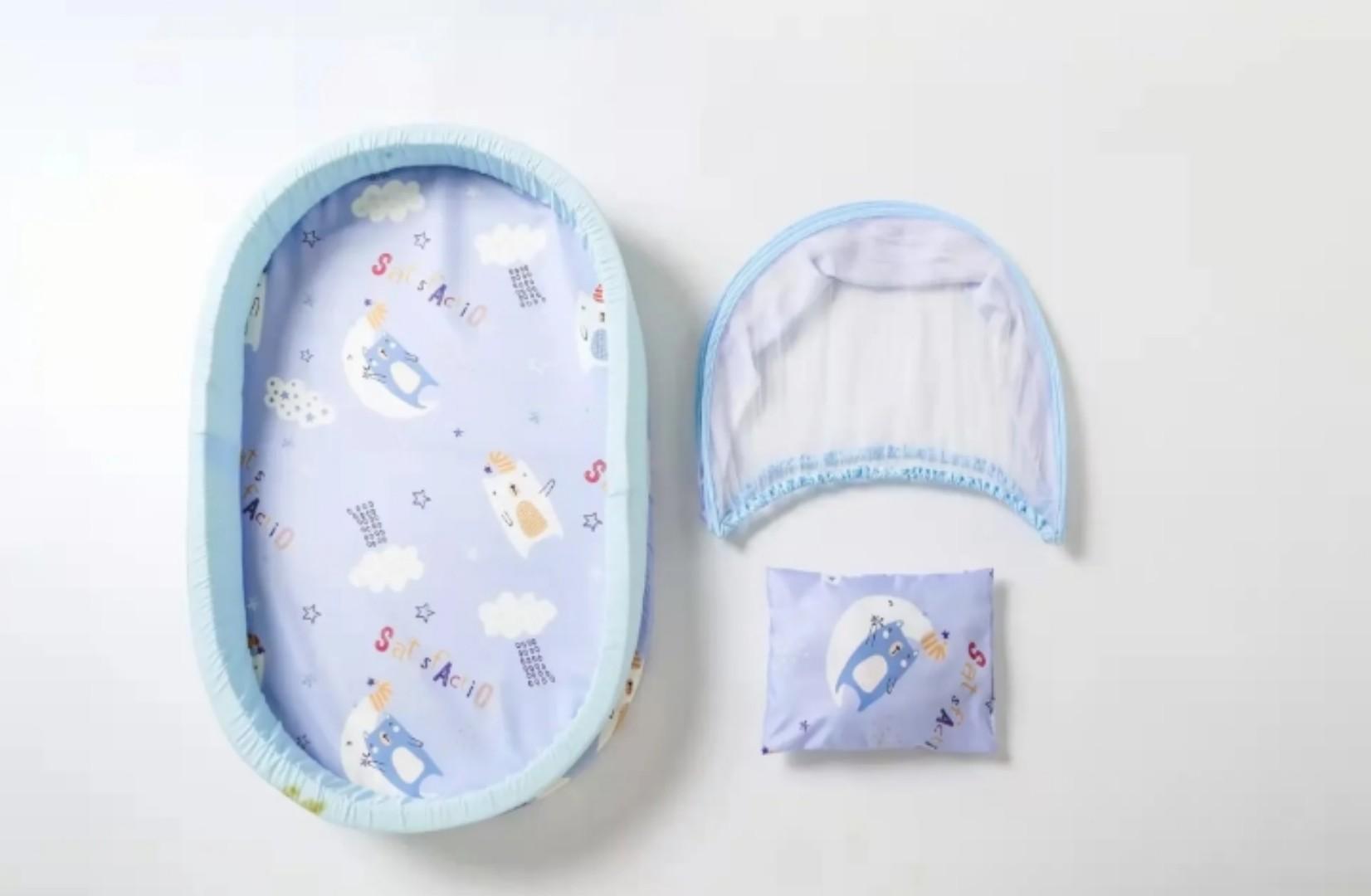Portable baby bed with an integrated mosquito net head pillow designed for infant sleep and protection