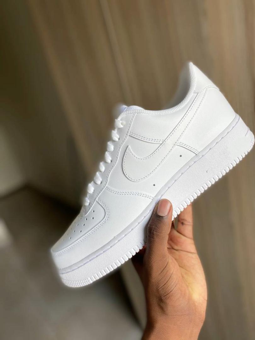 white Nike sneakers.Air force shoes. Gym shoes. sports shoes. men sneakers. women sneakers. sneakers. running shoes.white sneakers.