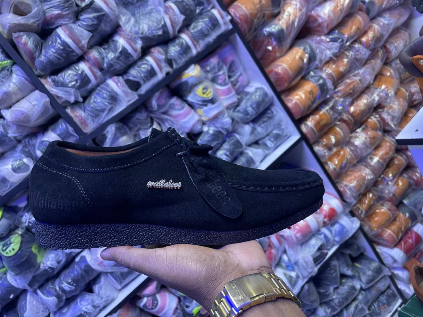 Clarks Wallabee Shoes – Timeless Comfort and Style"Description:Iconic Design: Features a classic moccasin-inspired silhouette for a unique, timeless look.Premium Material: Made from high-quality suede