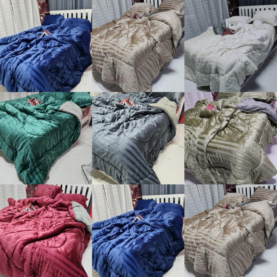 Soft Silk Duvet, 6 by 7. Comes with pillow cases and a bedsheet