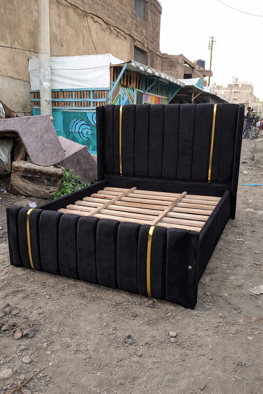 (OFFER!!!) Modern Upholstered Bed Frame – Black/Beige/Brown/Grey Velvet with Vertical Panel Design & Golden Accent Straps (Without mattress) 4*6ft, 5*6ft & 6*6ft Made In Kenya