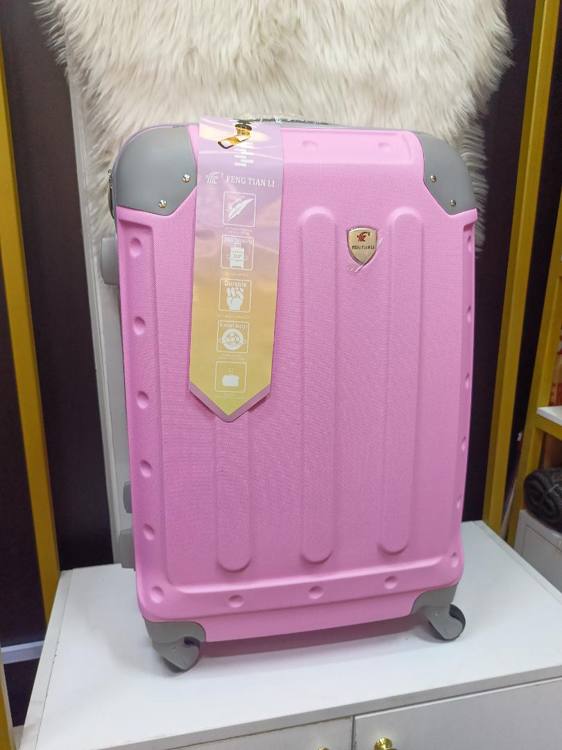 small fibre suitcase with grey corners, has straps