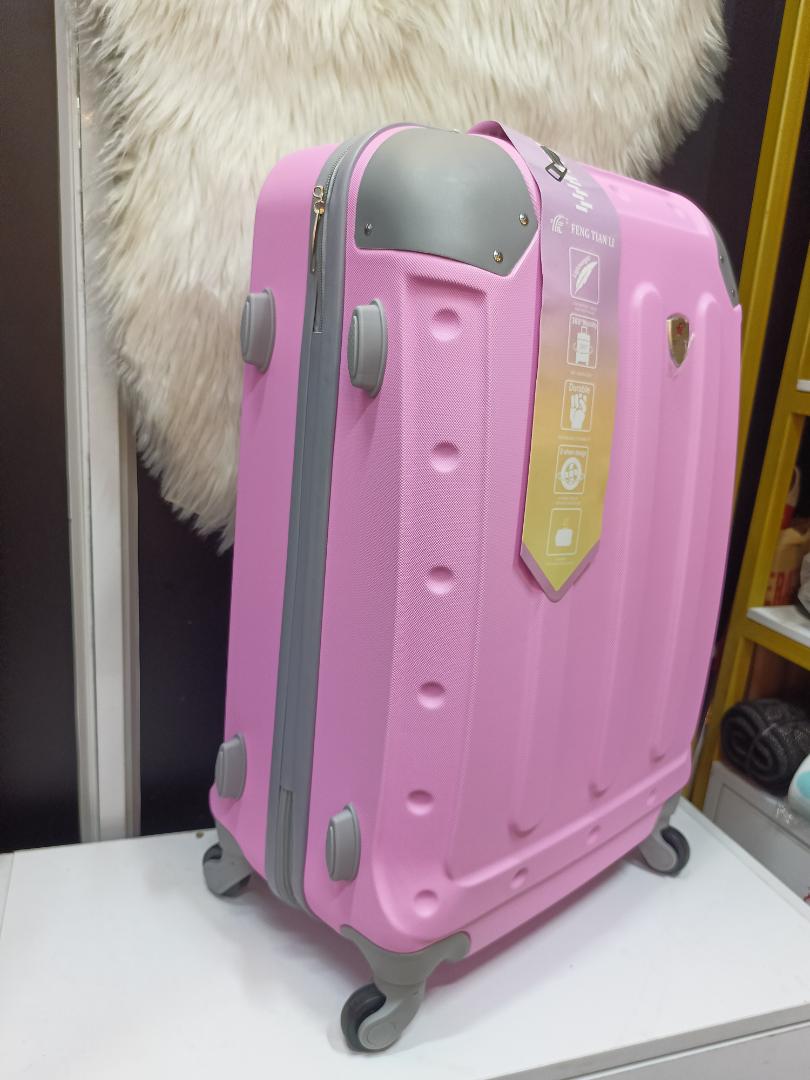 small fibre suitcase with grey corners, has straps