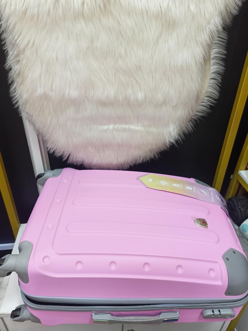 small fibre suitcase with grey corners, has straps