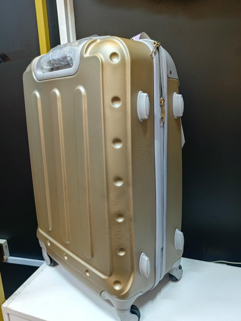 Medium golden travelling suitcase