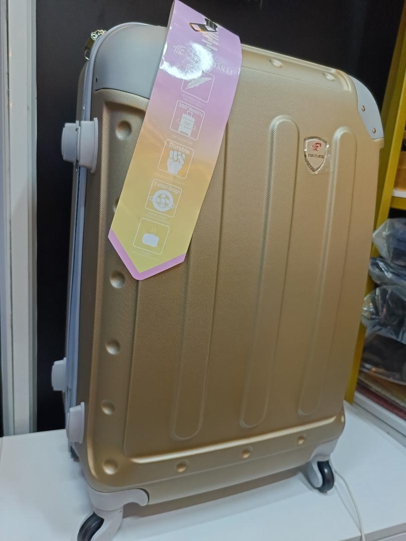 Medium golden travelling suitcase